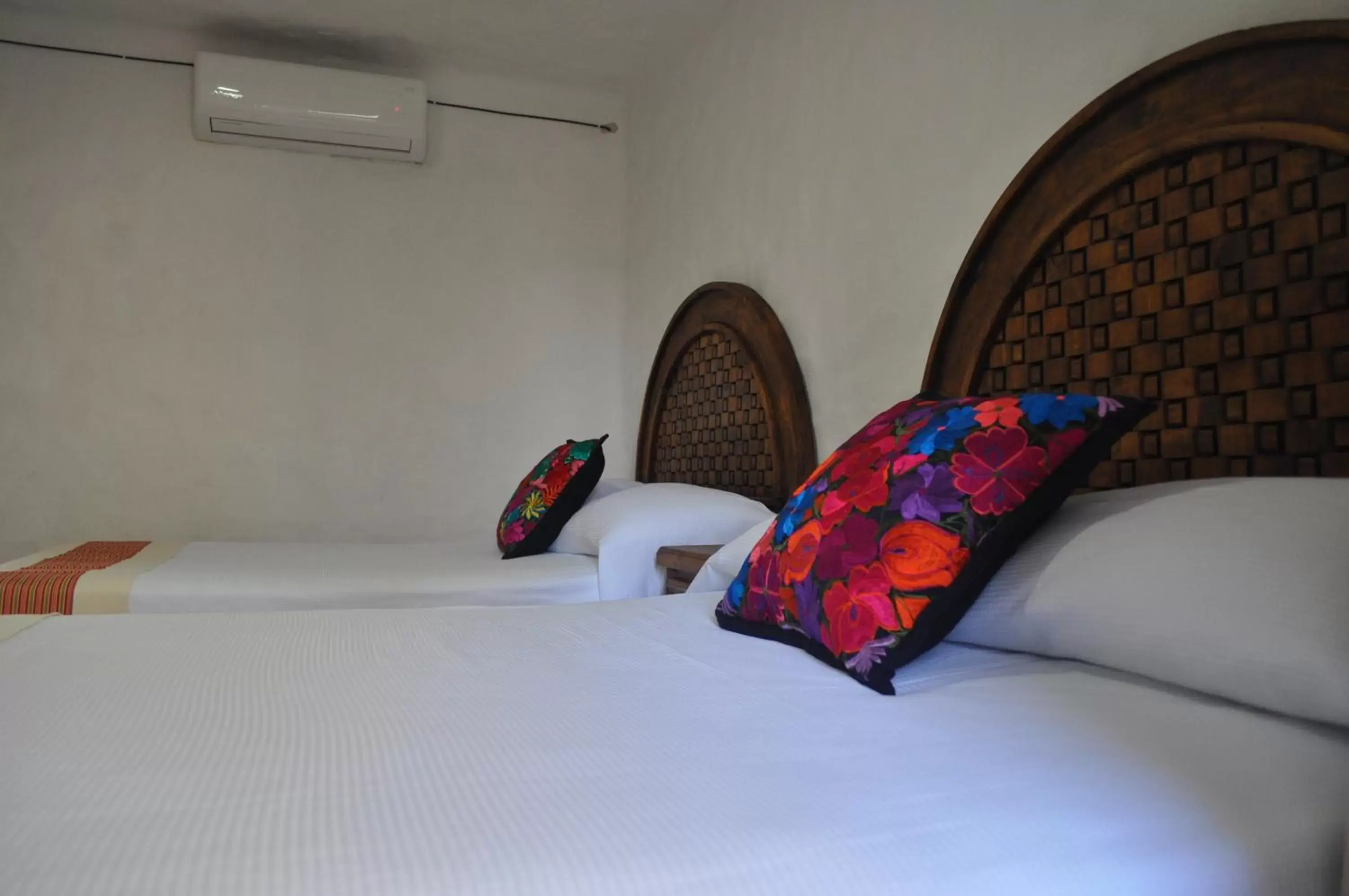 Bed in Petit Hotel Pilitas