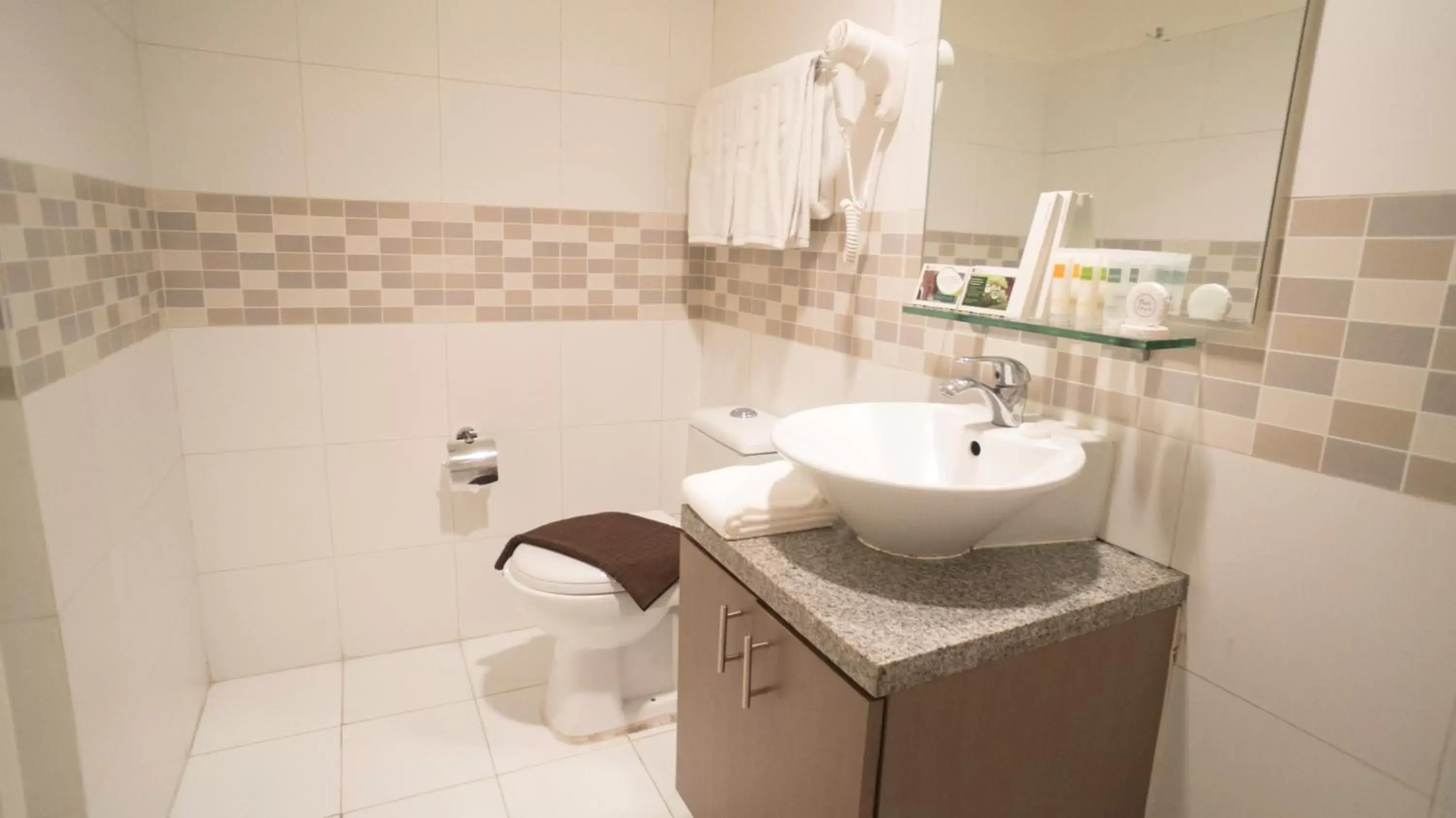 Bathroom in The Exchange Regency Residence Hotel Managed by HII