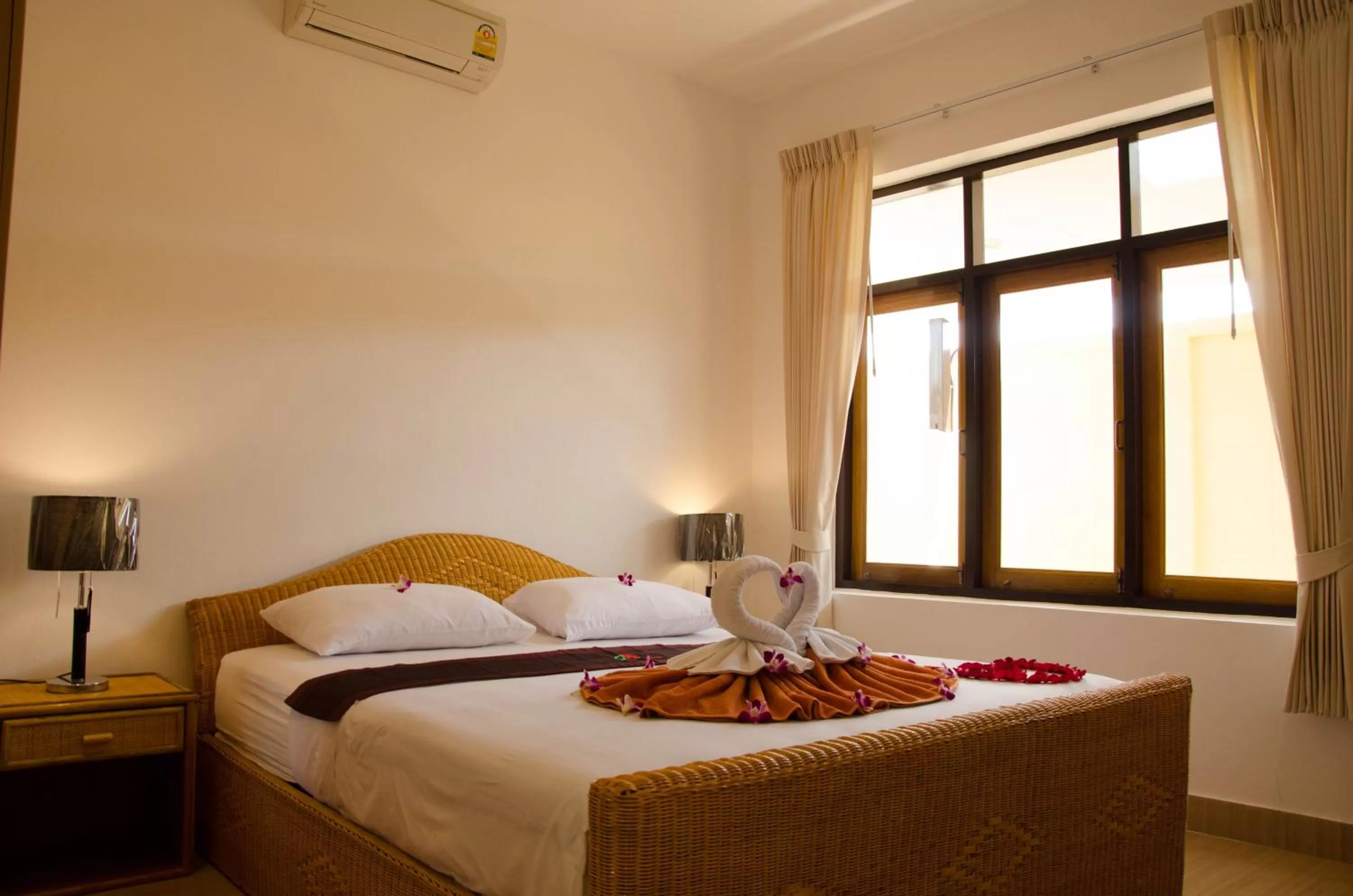 Bed in Jungle Village Bungalow