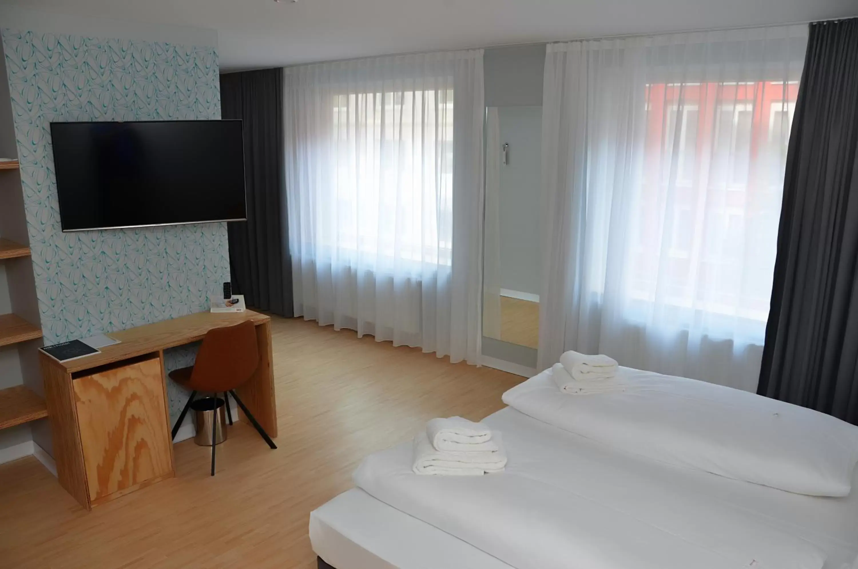 Bedroom, TV/Entertainment Center in mk | hotel münchen city