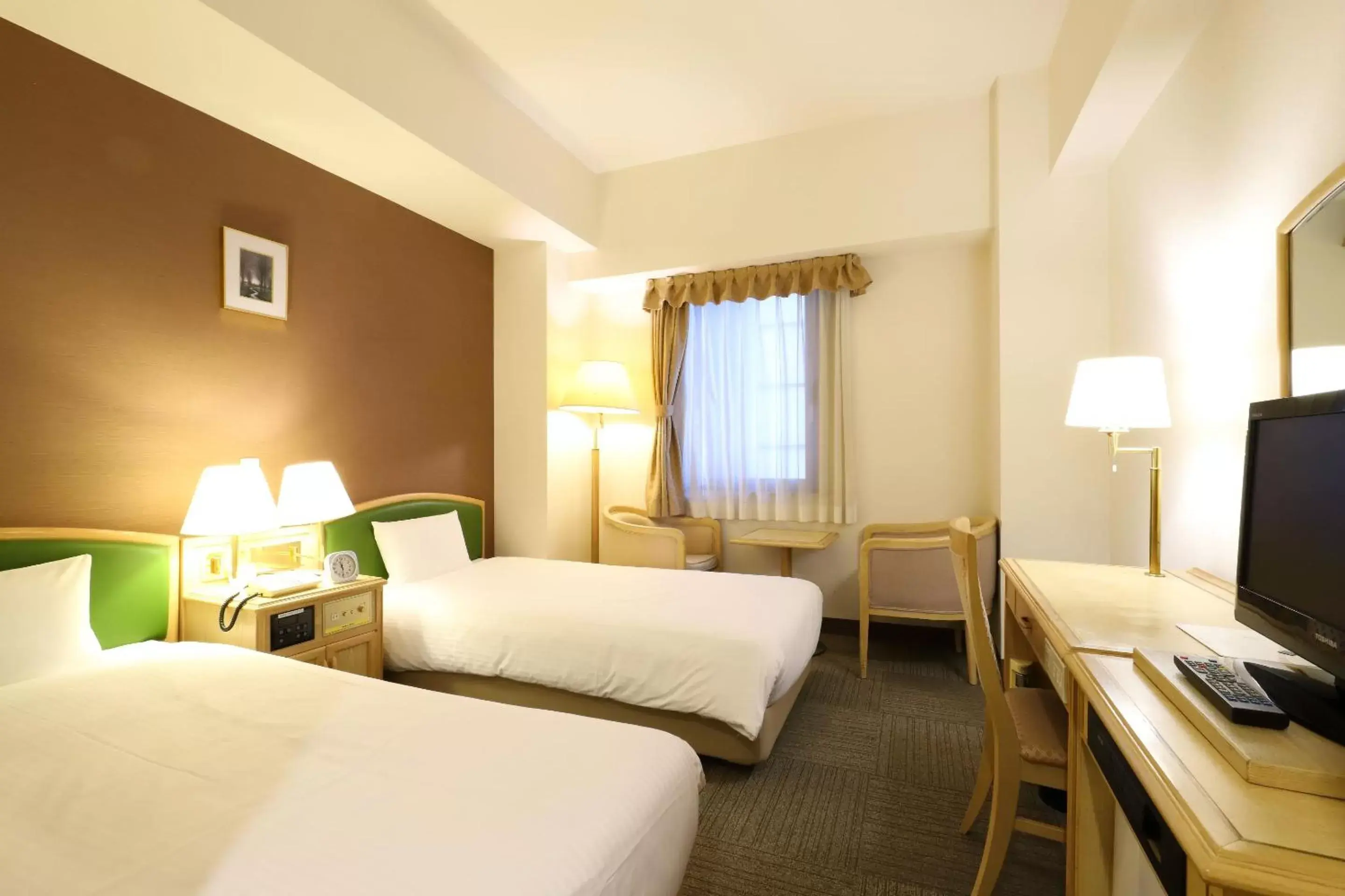 Bed in Smile Hotel Nagoya Shinkansenguchi