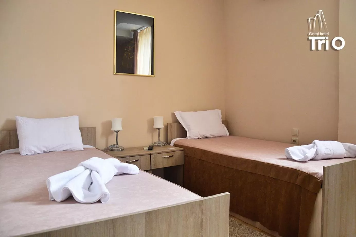 Bed in Garni Hotel Tri O