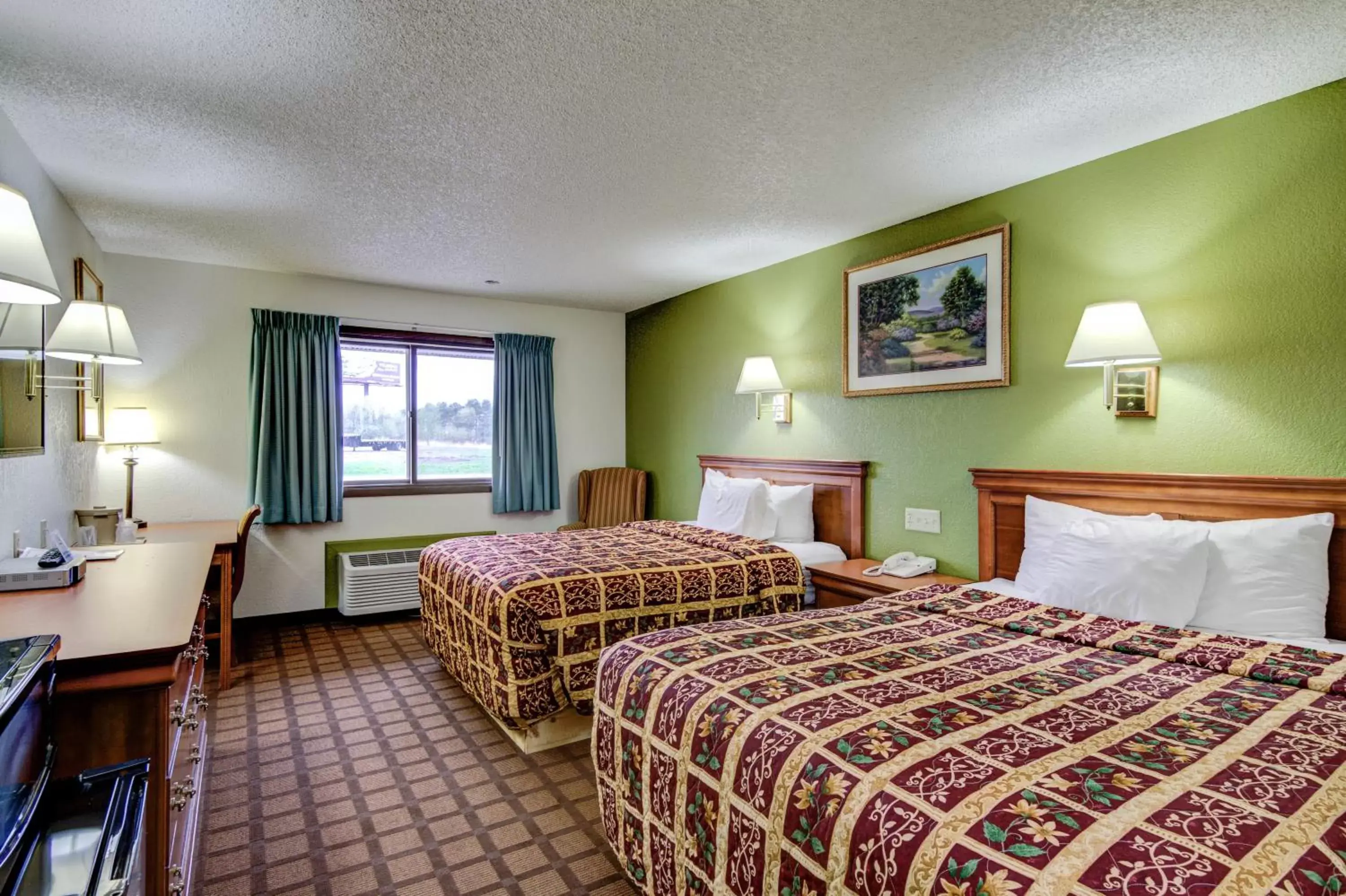 Bed in Bloomer Inn & Suites