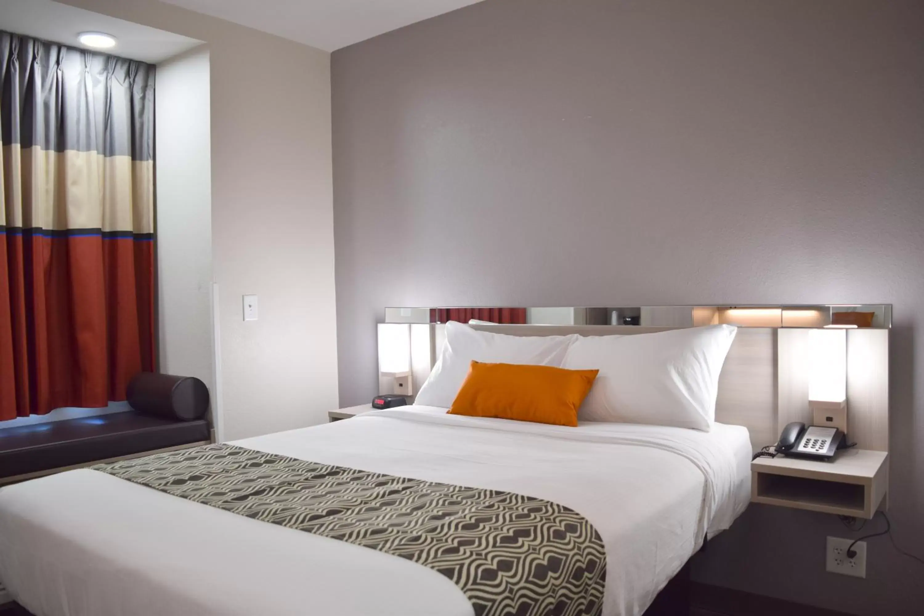 Bed in Microtel Inn & Suites by Wyndham Raleigh