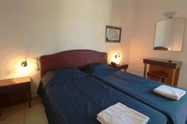 Bed in Polydoros Appartments