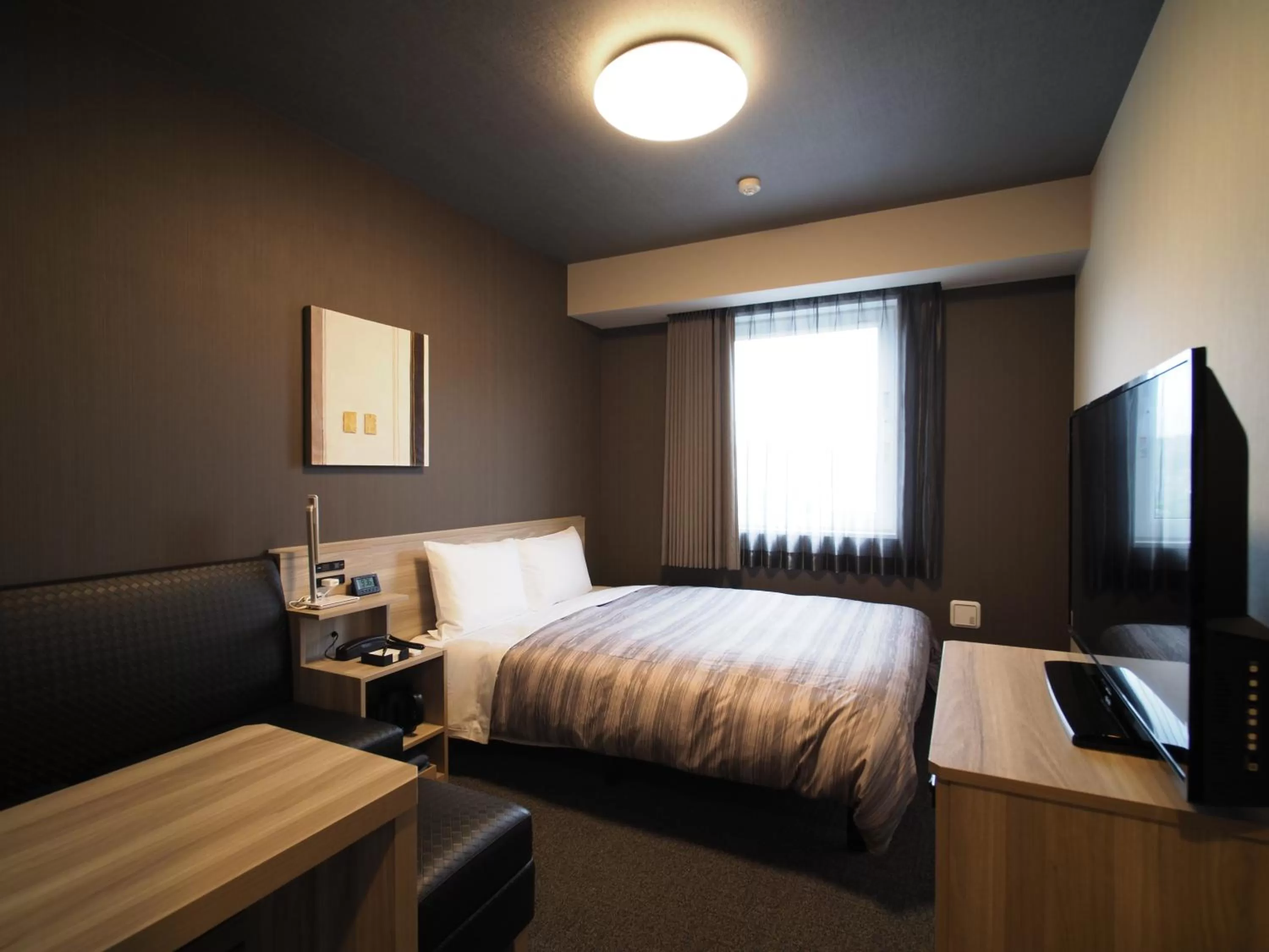 Bed in Hotel Route-Inn Nihonmatsu -Kokudo 4Gou-