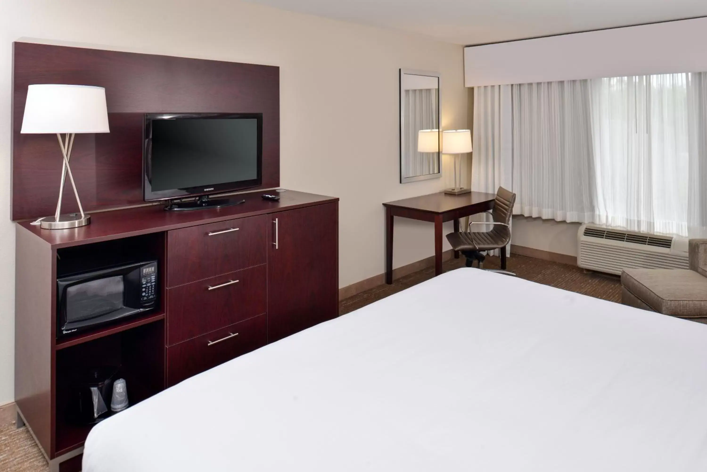 Photo of the whole room, TV/Entertainment Center in Holiday Inn Express Hotel & Suites Lafayette, an IHG Hotel