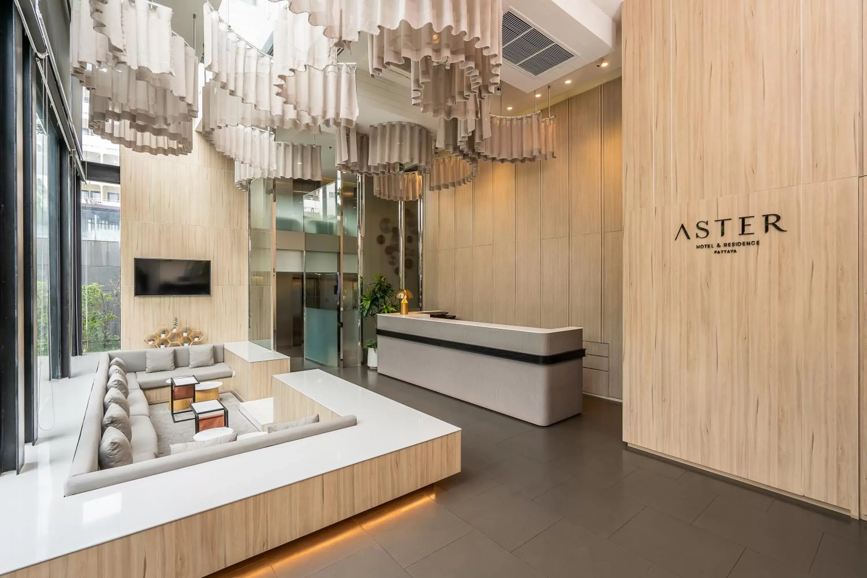 Lobby or reception in Aster Hotel and Residence by At Mind