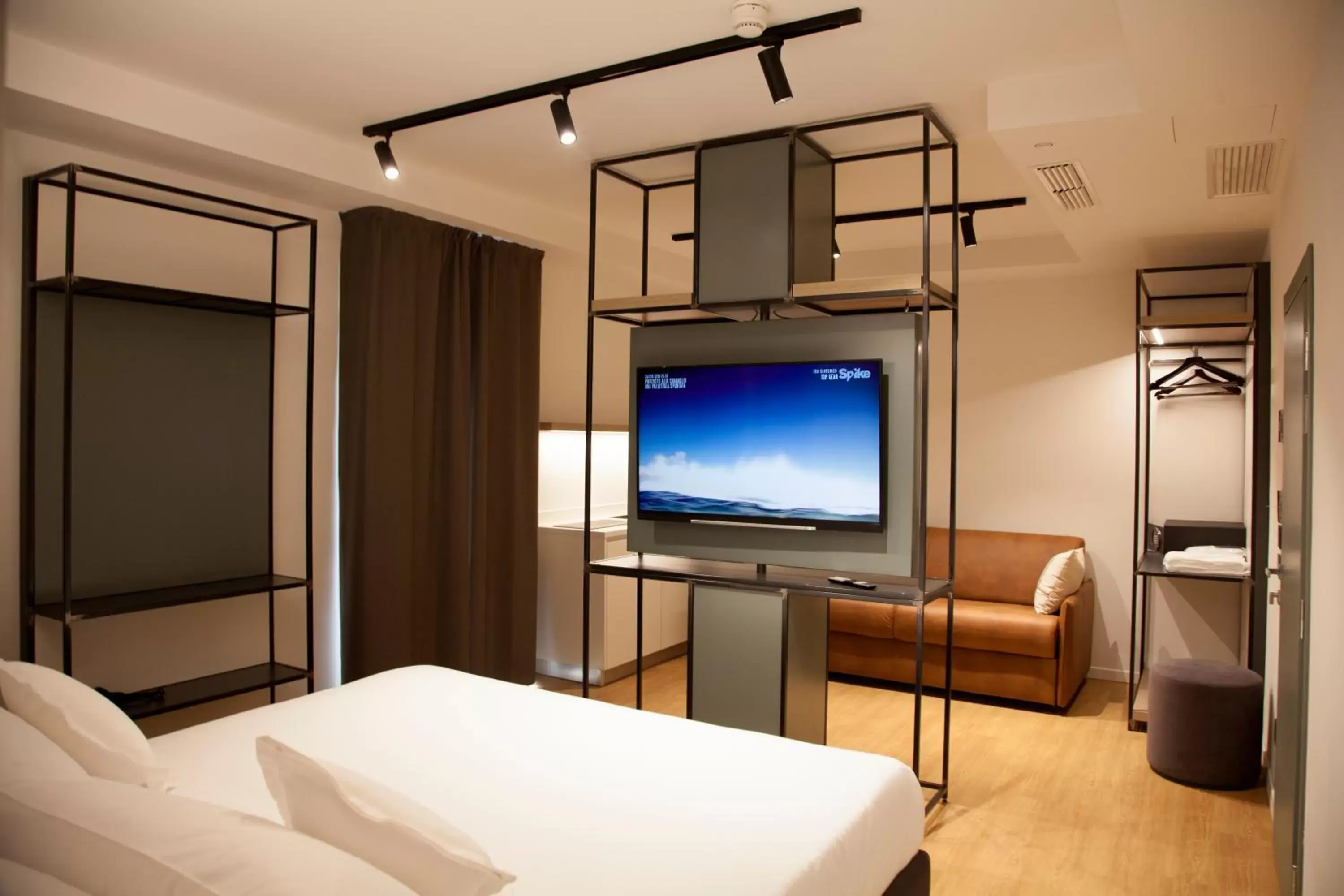 Bed, TV/Entertainment Center in Meg Lifestyle Hotel