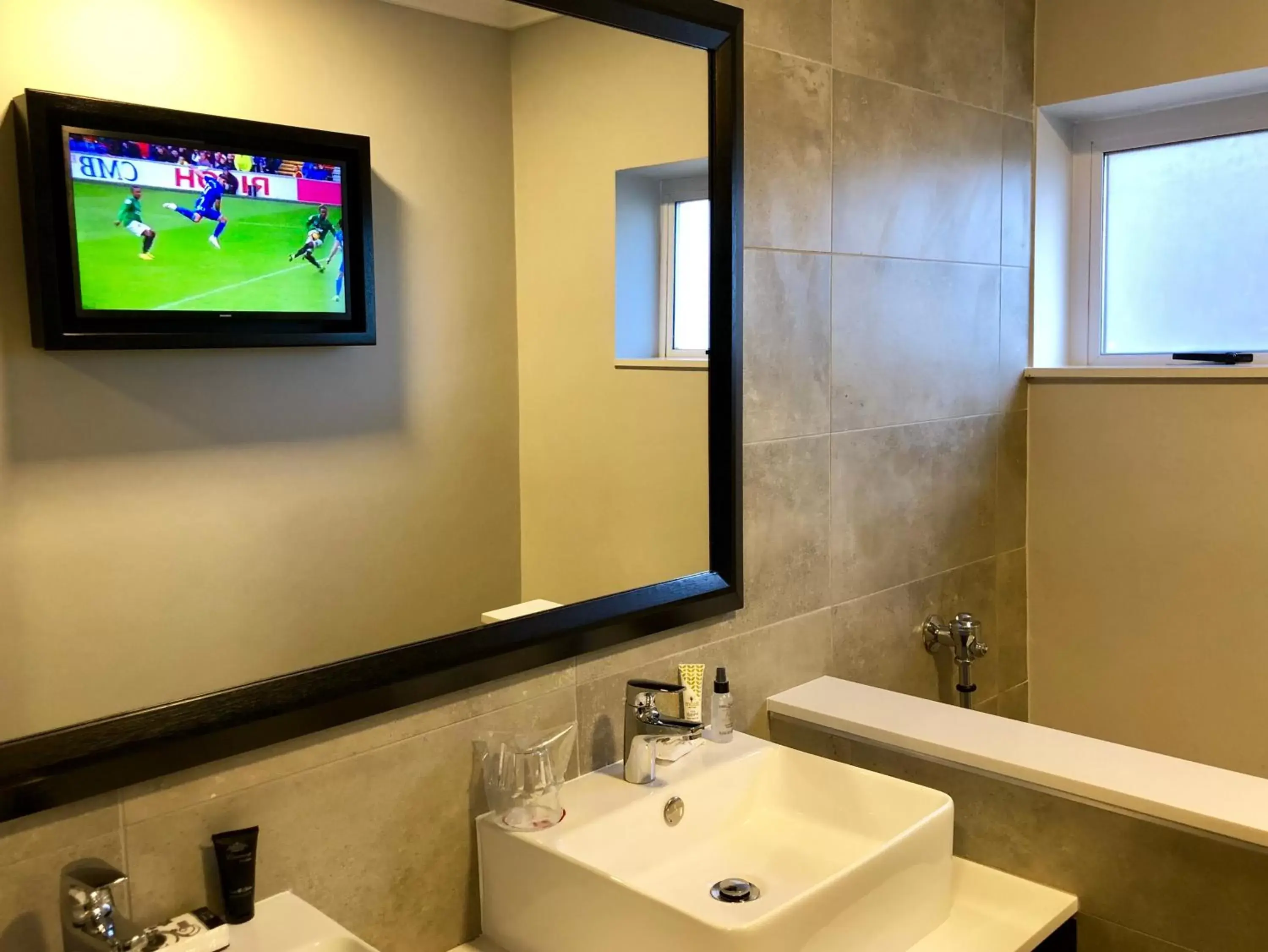 Bathroom in Belaire Suites Hotel