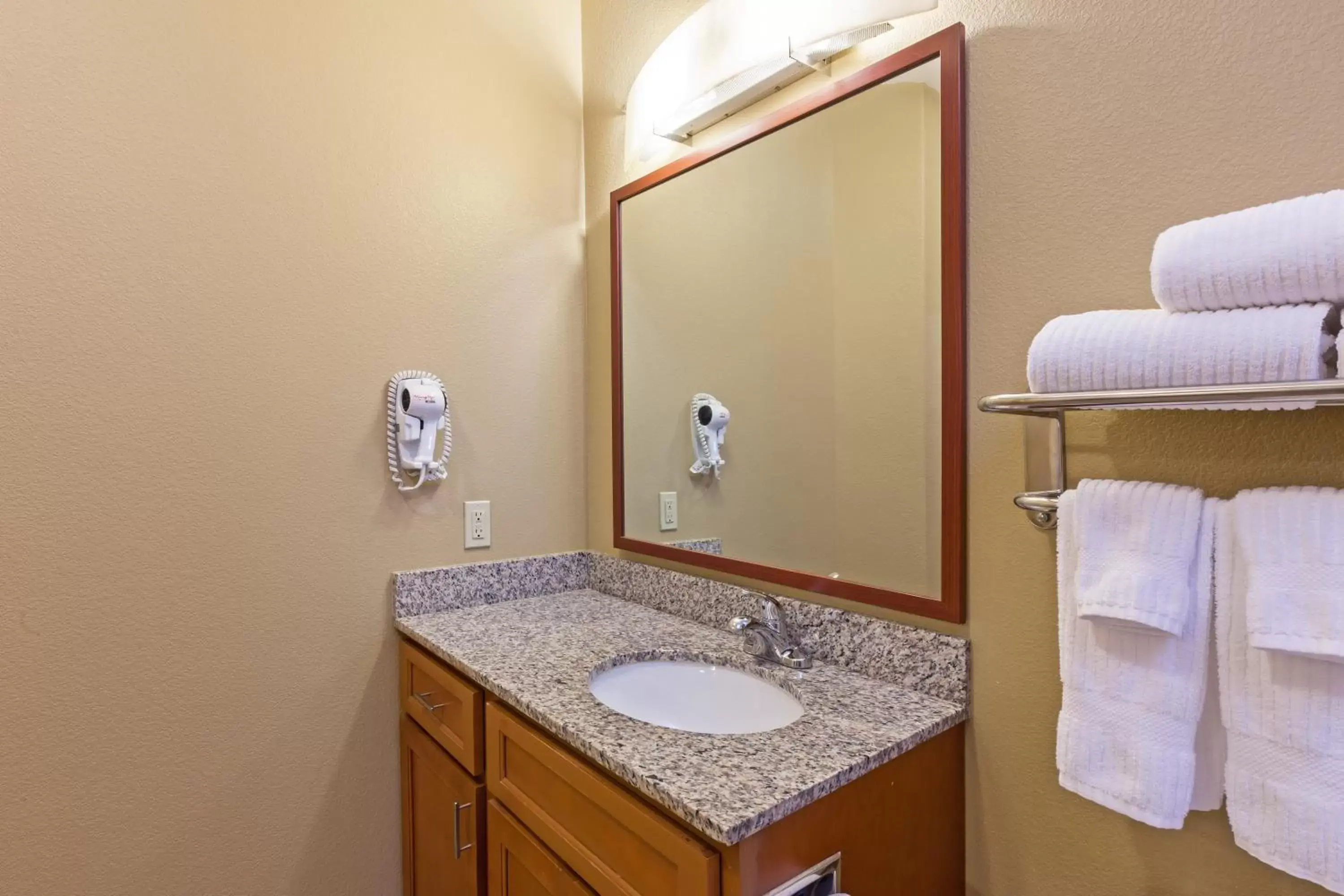 Bathroom in Candlewood Suites Deer Park, an IHG Hotel