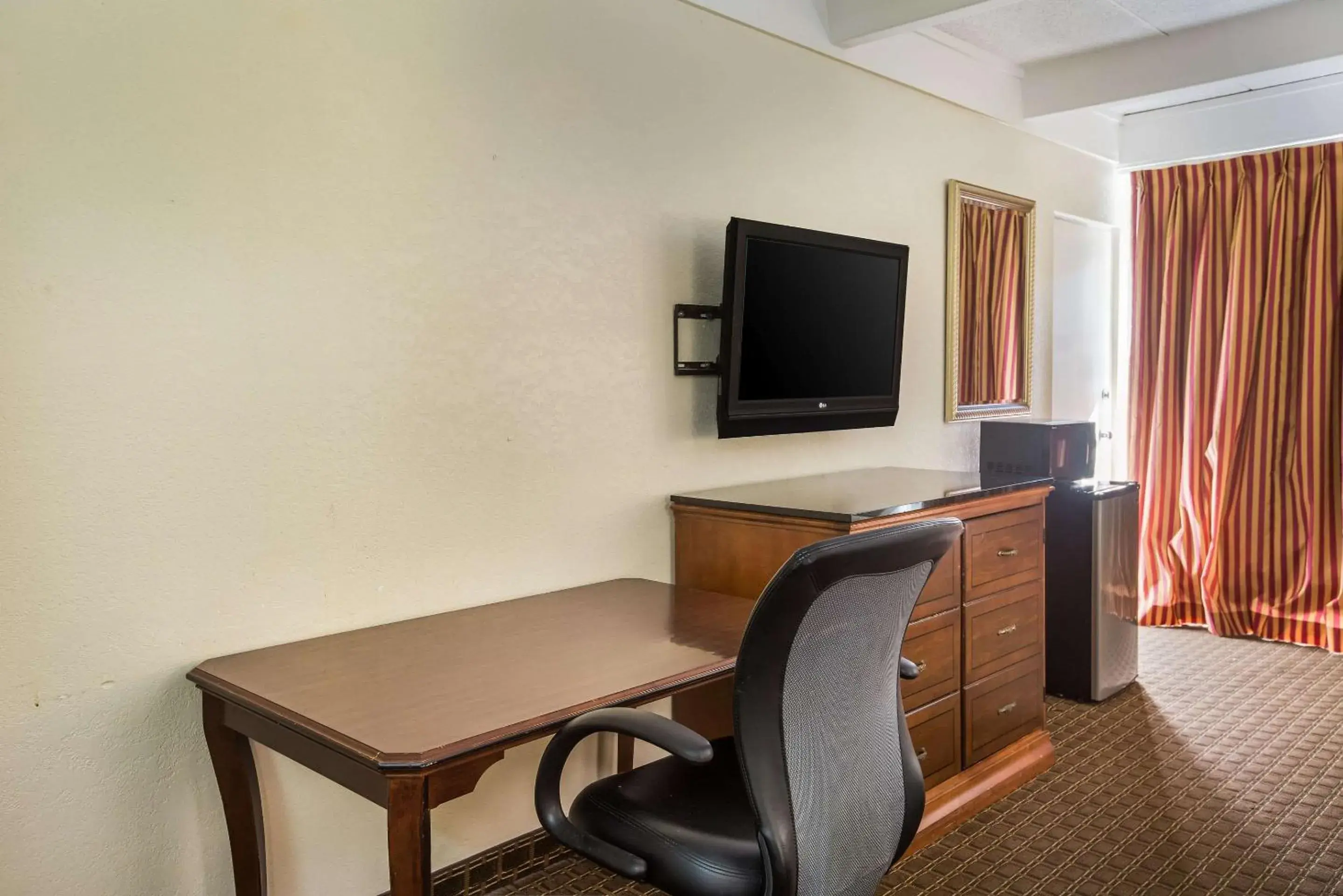 Photo of the whole room, TV/Entertainment Center in Super 8 by Wyndham Macon GA