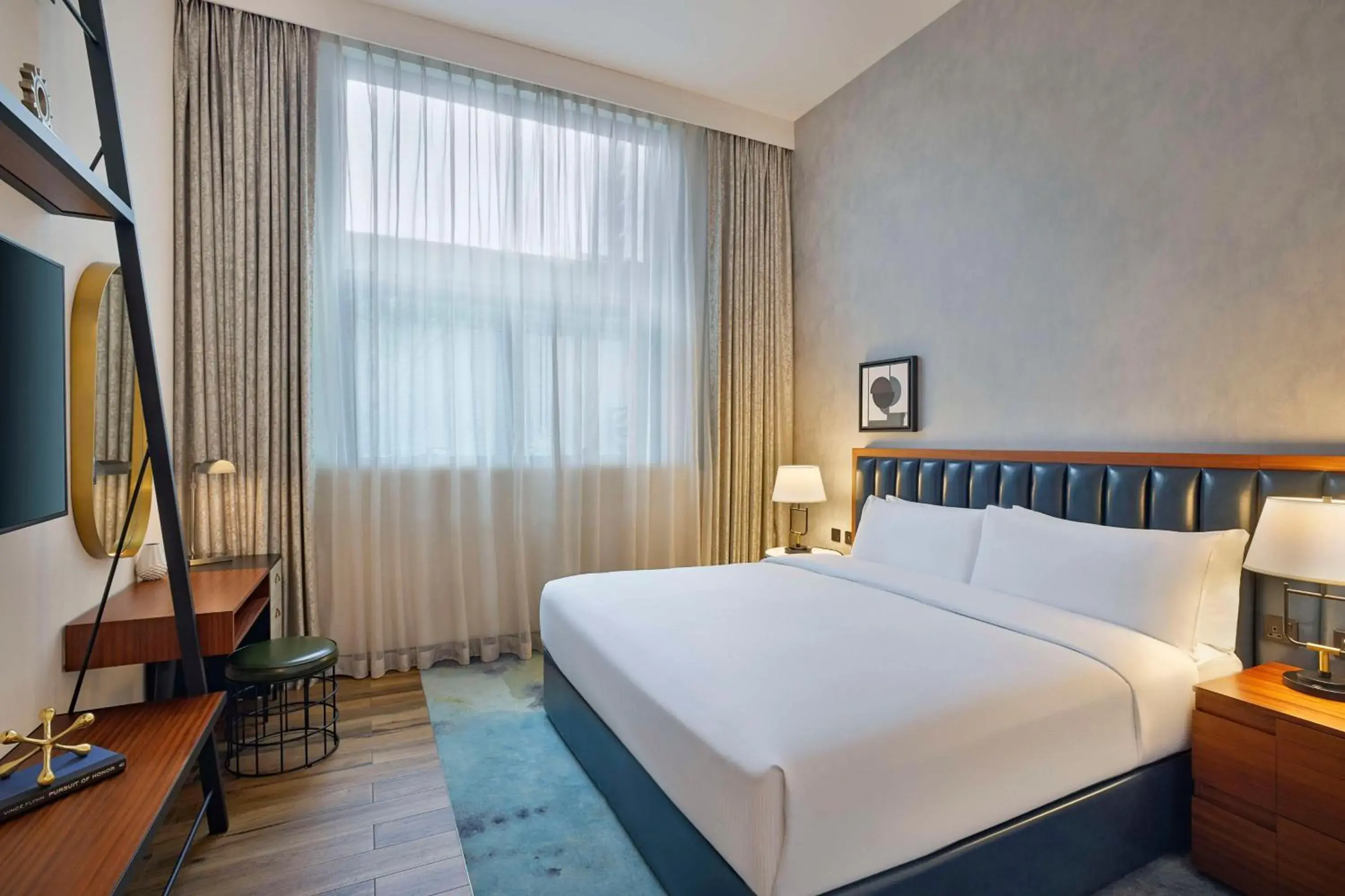 Bed in DoubleTree by Hilton Dubai M Square Hotel & Residences