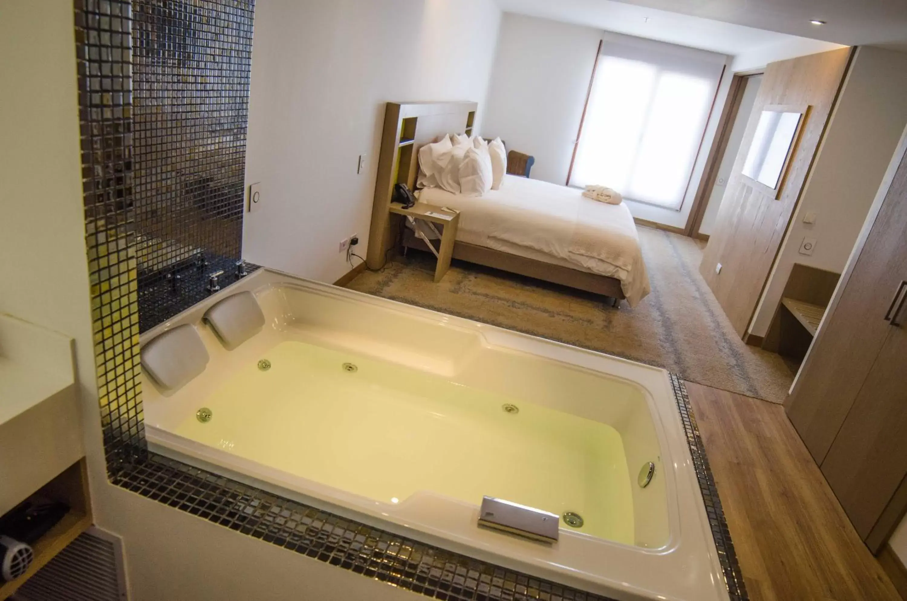 Bed, Bathroom in Biohotel Organic Suites
