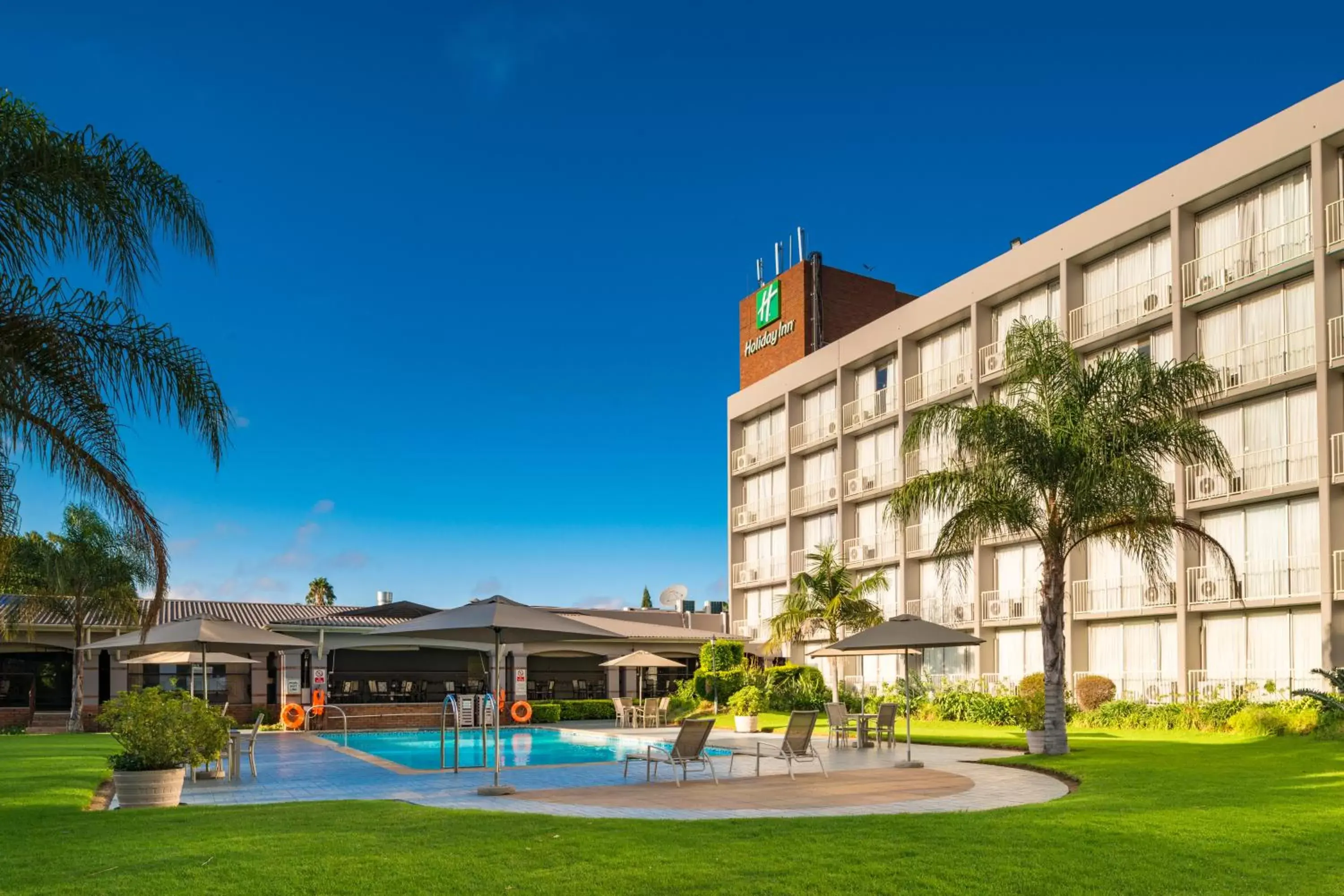 Swimming pool, Property Building in Holiday Inn - Bulawayo, an IHG Hotel