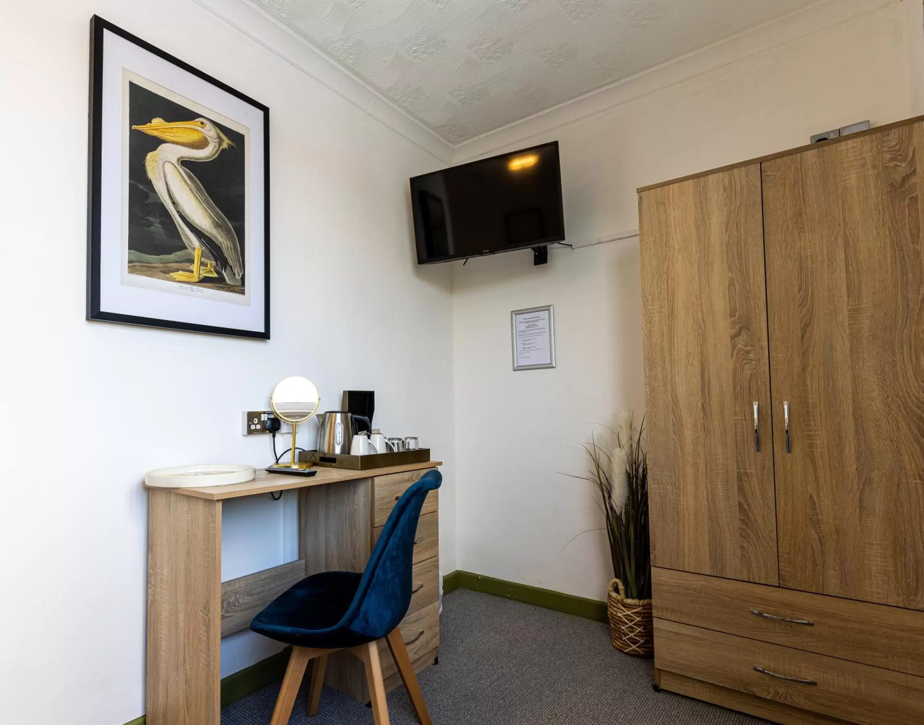 Bedroom, TV/Entertainment Center in The Angharad Hotel and Restaurant