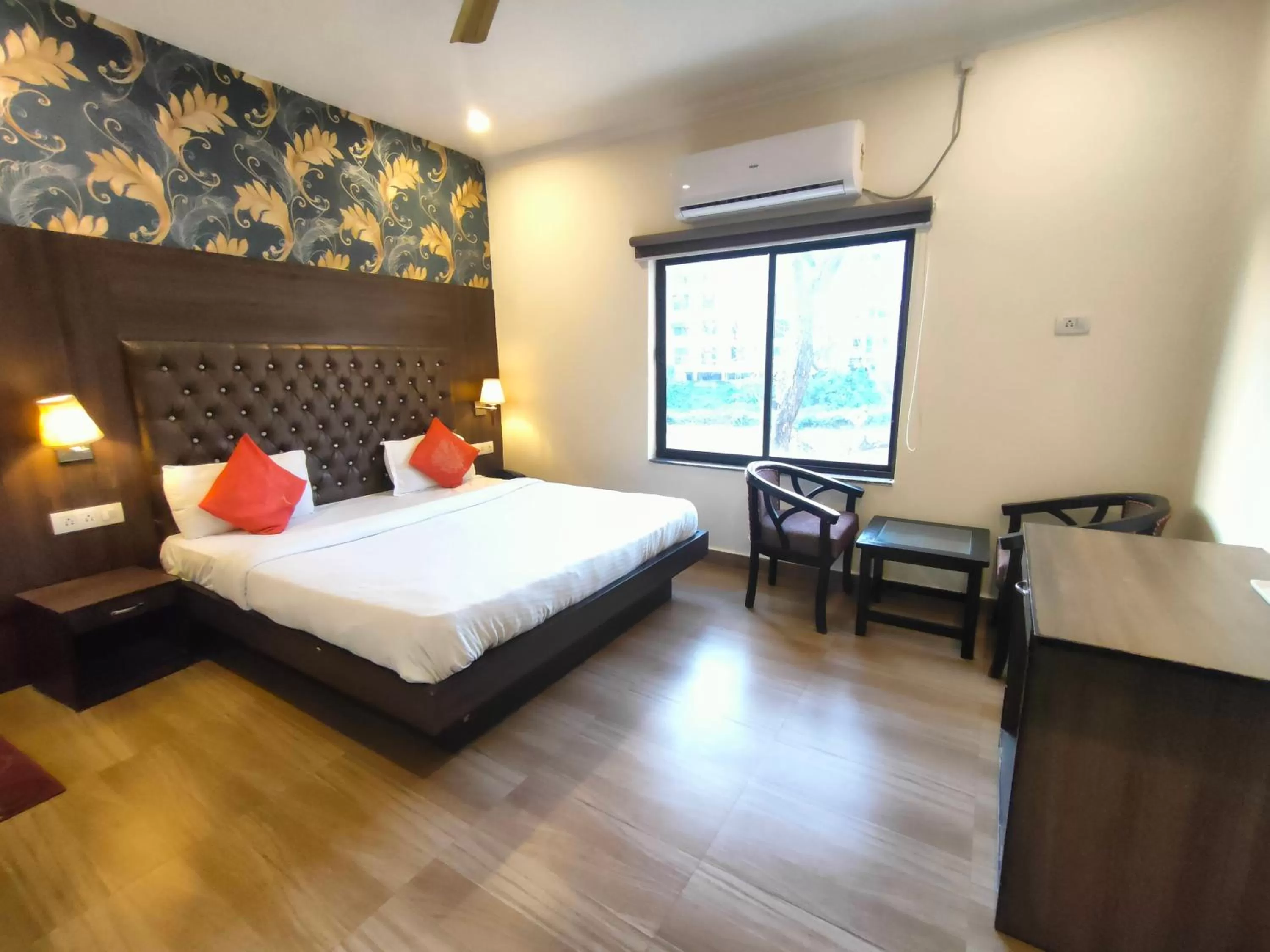 Photo of the whole room, Bed in Tapasthali by Meera Hotels