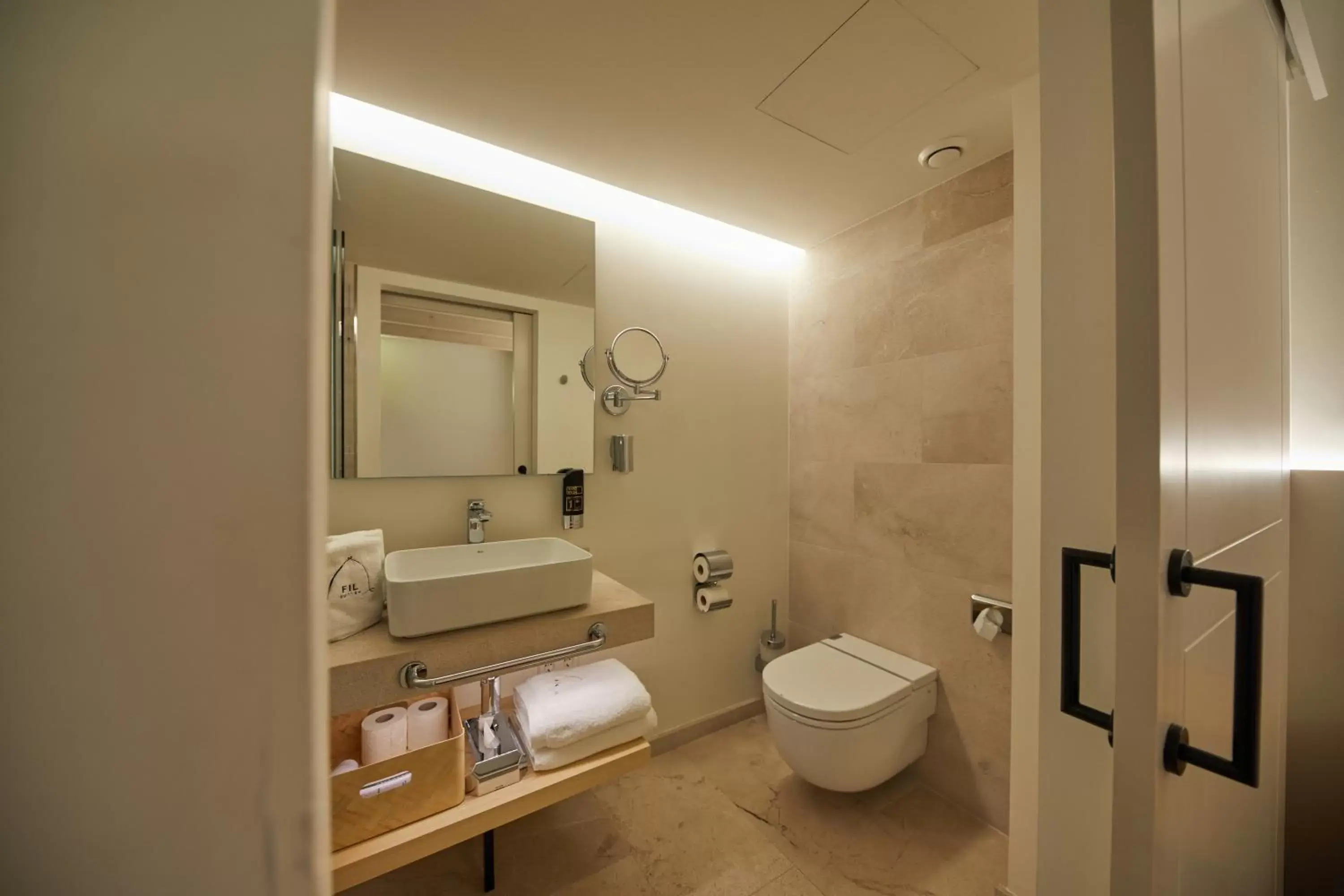 Toilet, Bathroom in Fil Suites