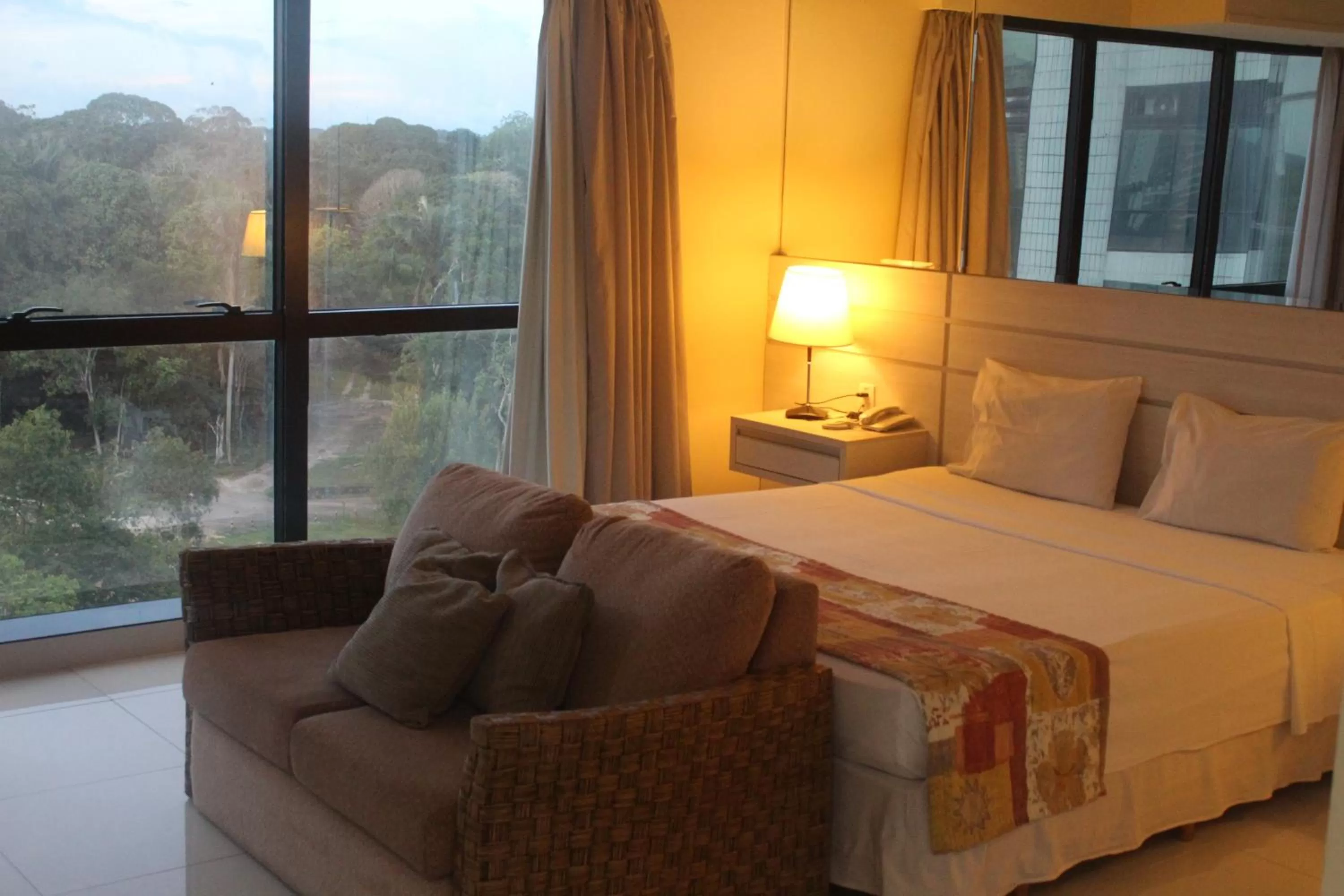 Bed in Tropical Executive Hotel