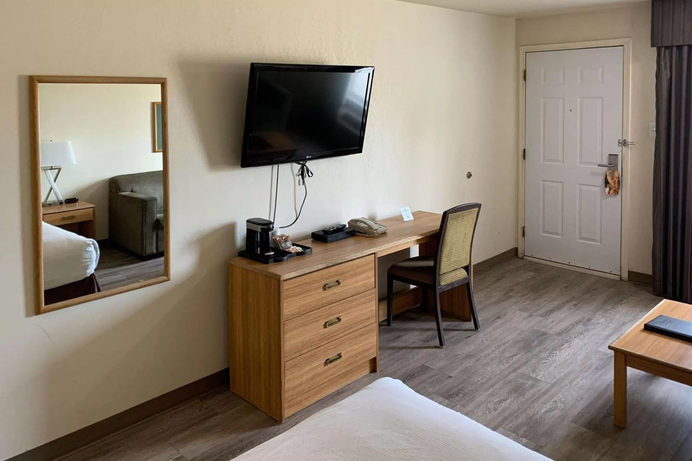 Photo of the whole room, TV/Entertainment Center in Rodeway Inn