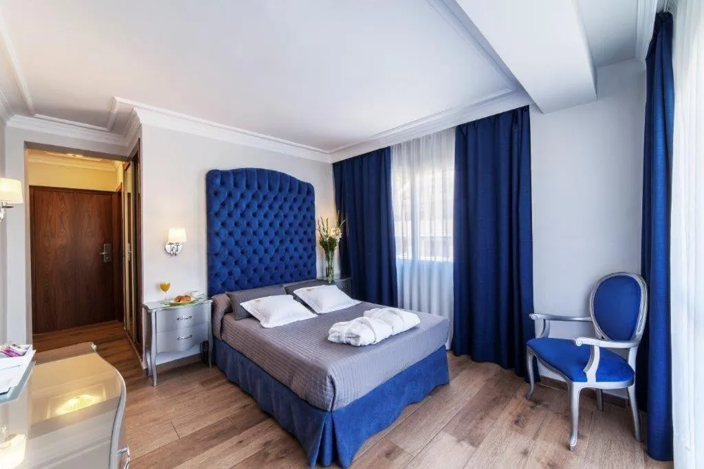 Bed in Essence Hotel Boutique