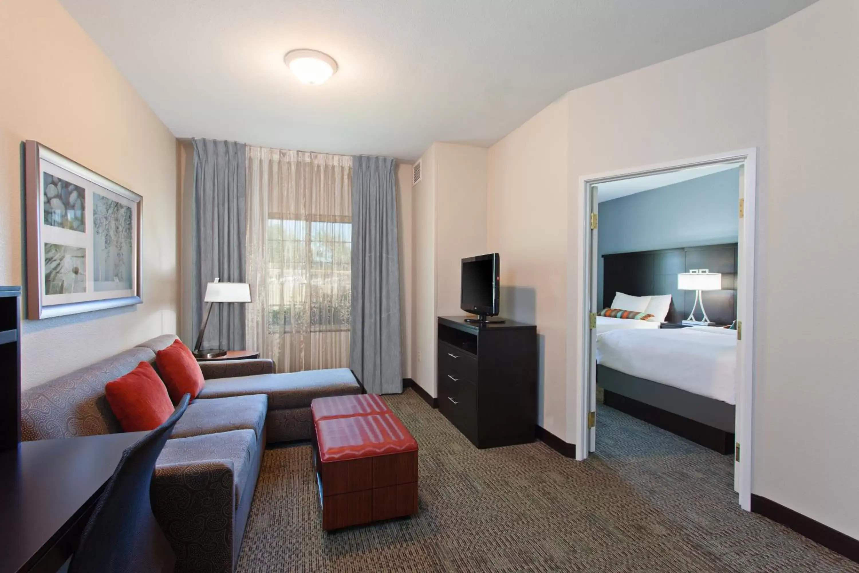 Bed, Seating Area in Staybridge Suites Fairfield Napa Valley Area, an IHG Hotel