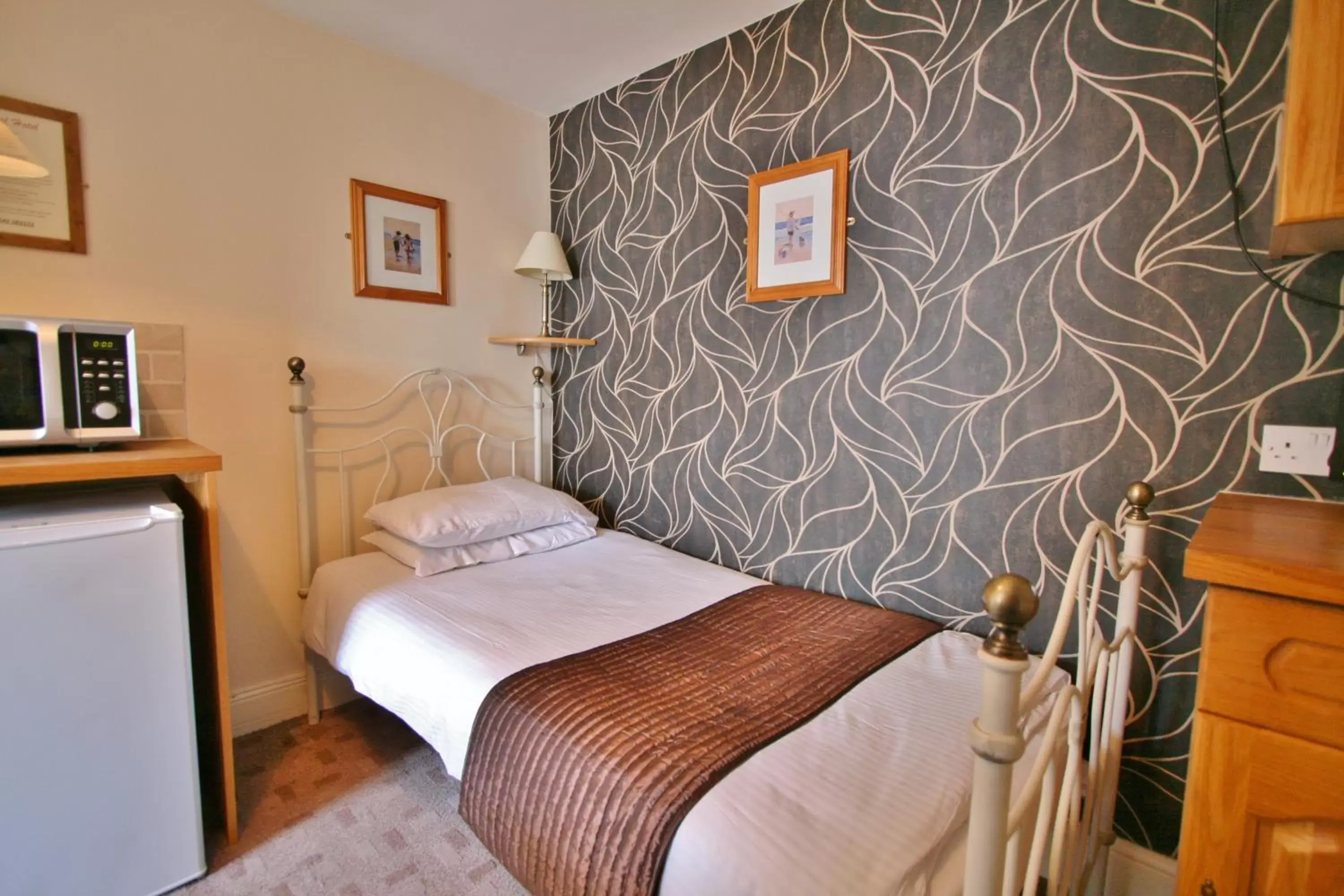 Bedroom, Bed in Central Hotel Cheltenham by Roomsbooked