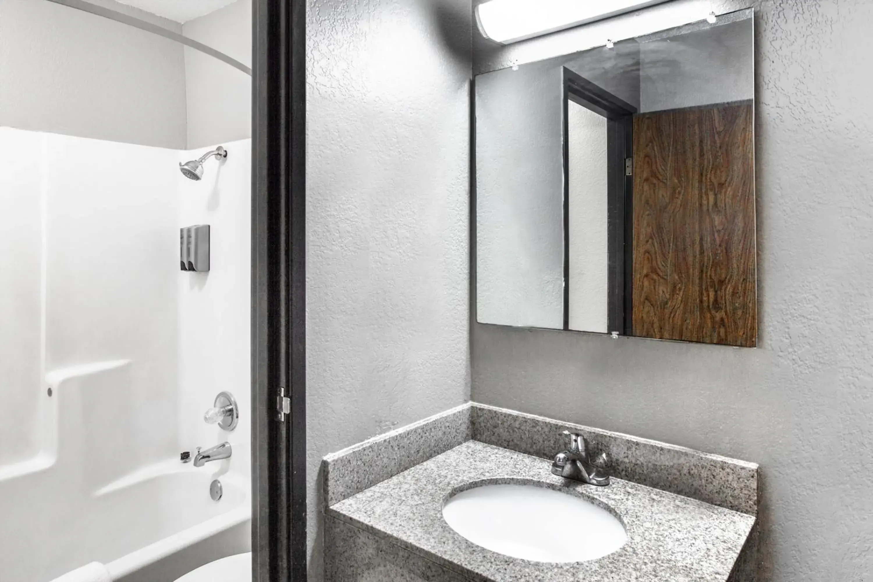 Bathroom in Super 8 by Wyndham Sherman