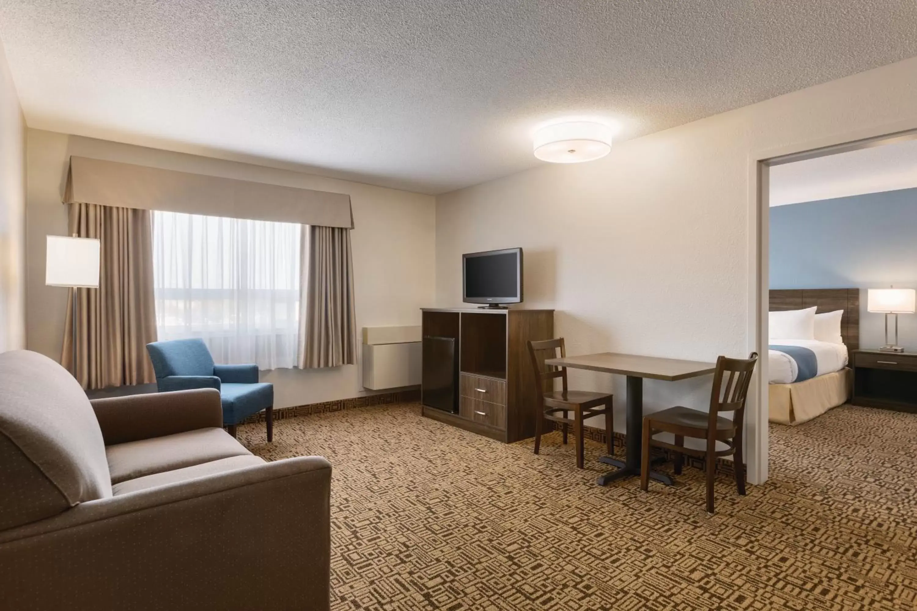 Bedroom, Seating Area in Travelodge Suites by Wyndham New Glasgow
