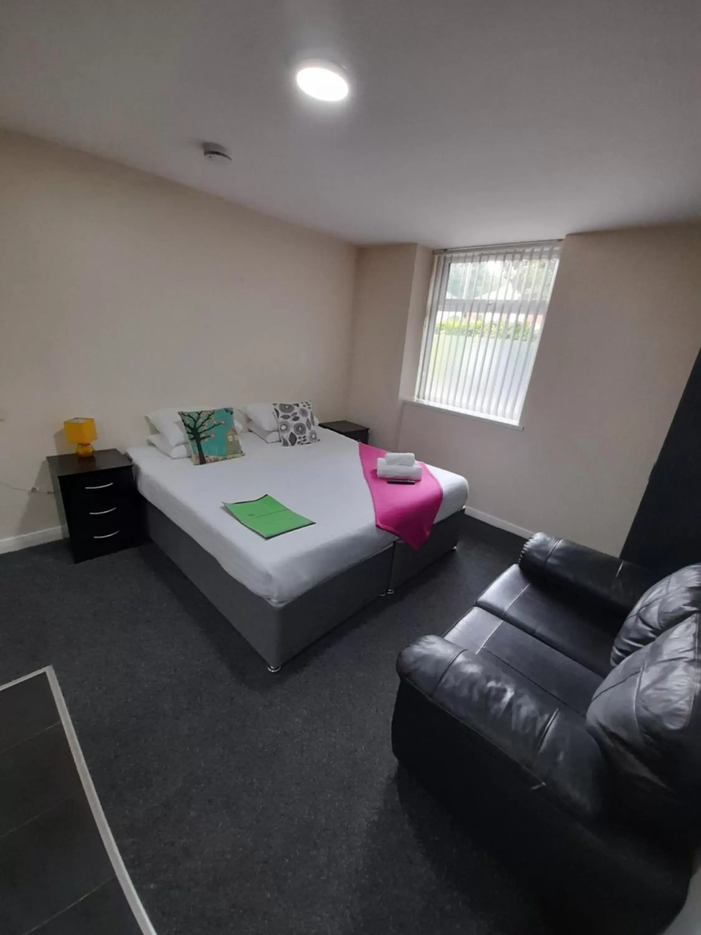 Bed, Seating Area in Lymedale Suites Studios & Aparthotel in NEWCASTLE UNDER LYME & STOKE