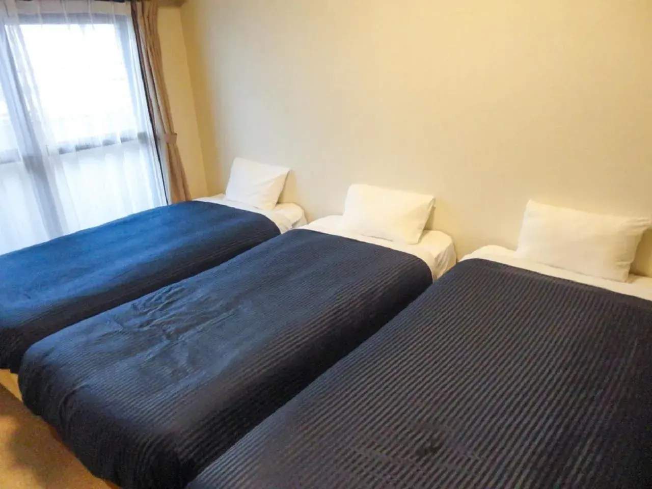 Bed in HOTEL LiVEMAX BUDGET名古屋