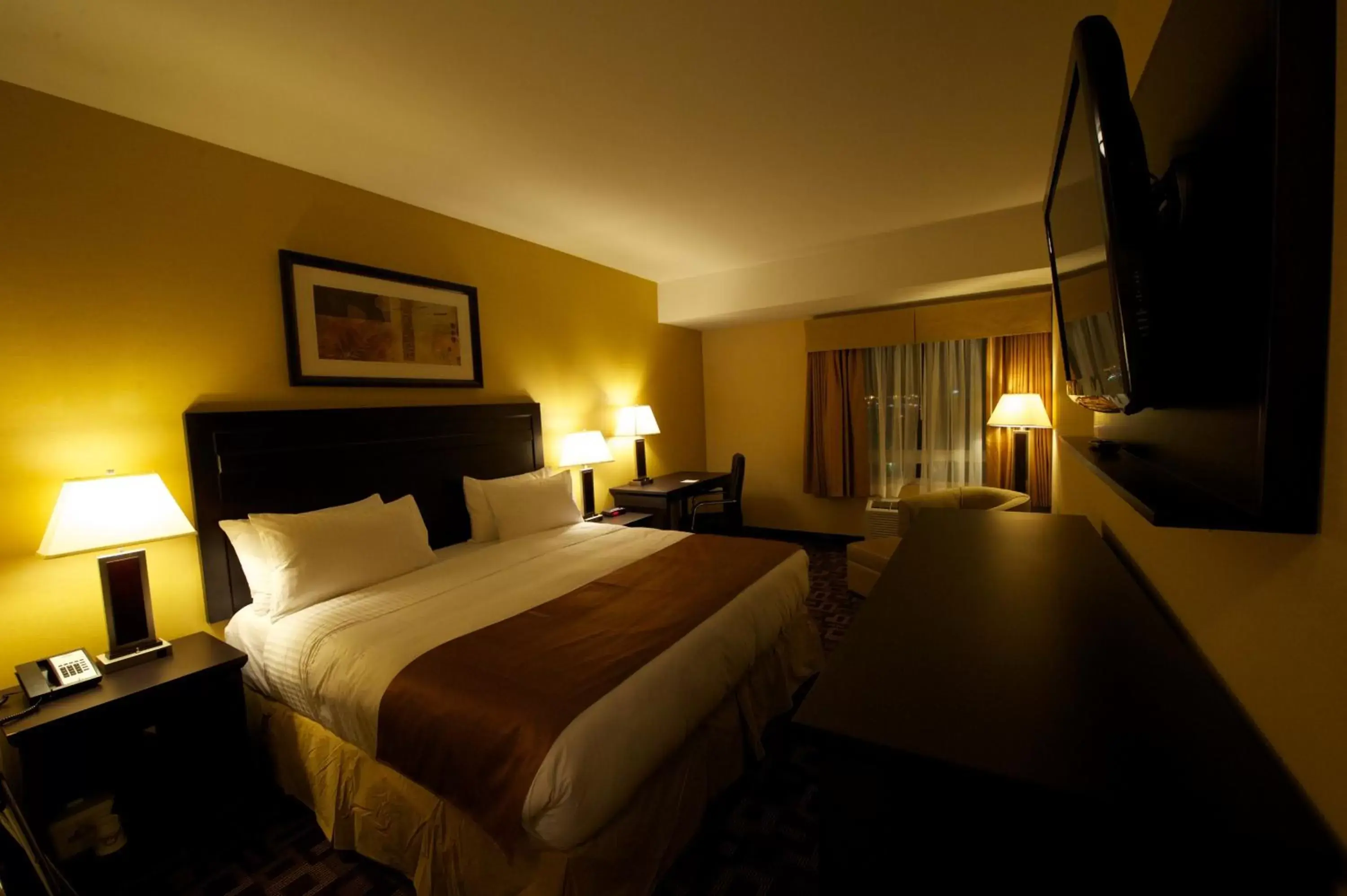 Photo of the whole room, Bed in Days Inn & Suites by Wyndham Winnipeg Airport Manitoba