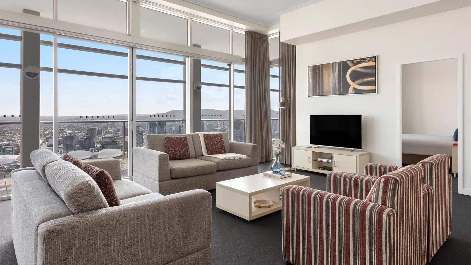 TV and multimedia, Seating Area in Oaks Brisbane Casino Tower Suites