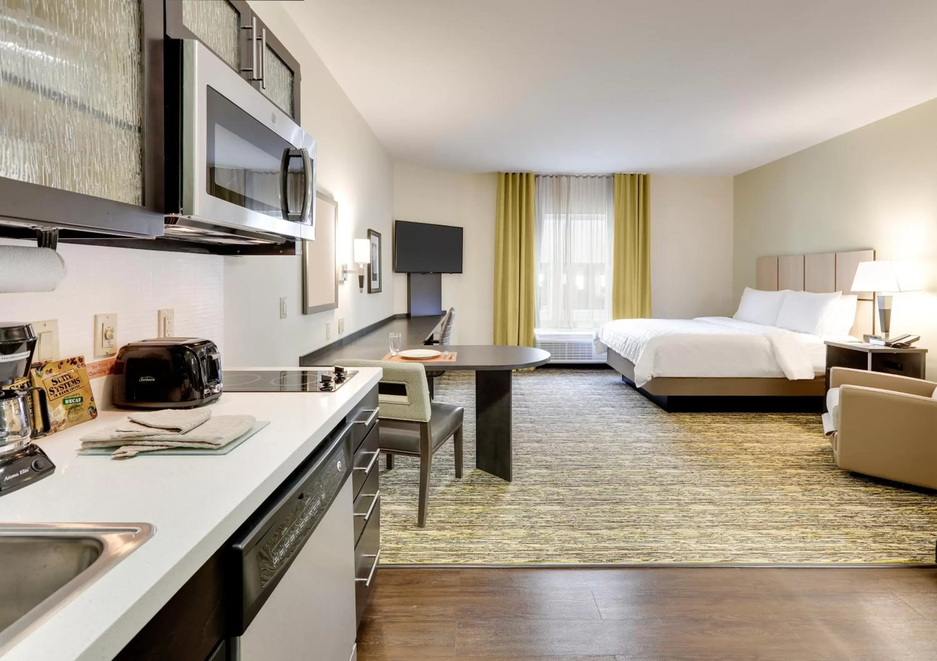 Photo of the whole room, Kitchen/Kitchenette in Candlewood Suites - Farmers Branch, an IHG Hotel