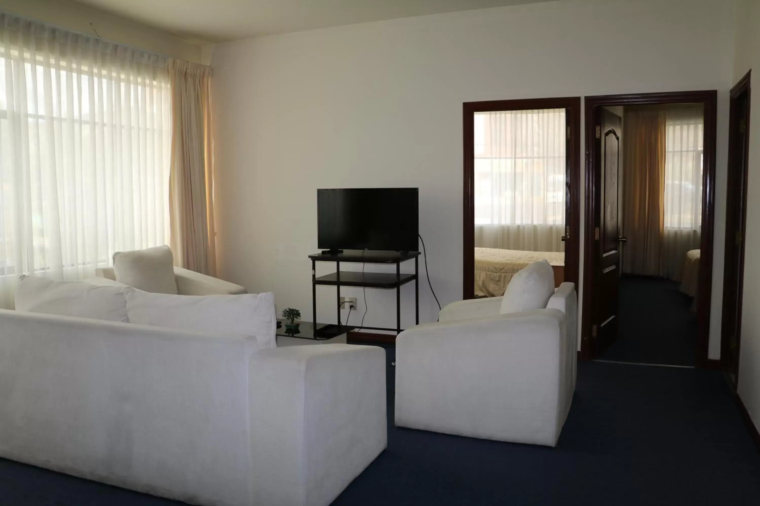 Living room, Bed in Delfines Apart Hotel Living room, Bed in Delfines Apart Hotel