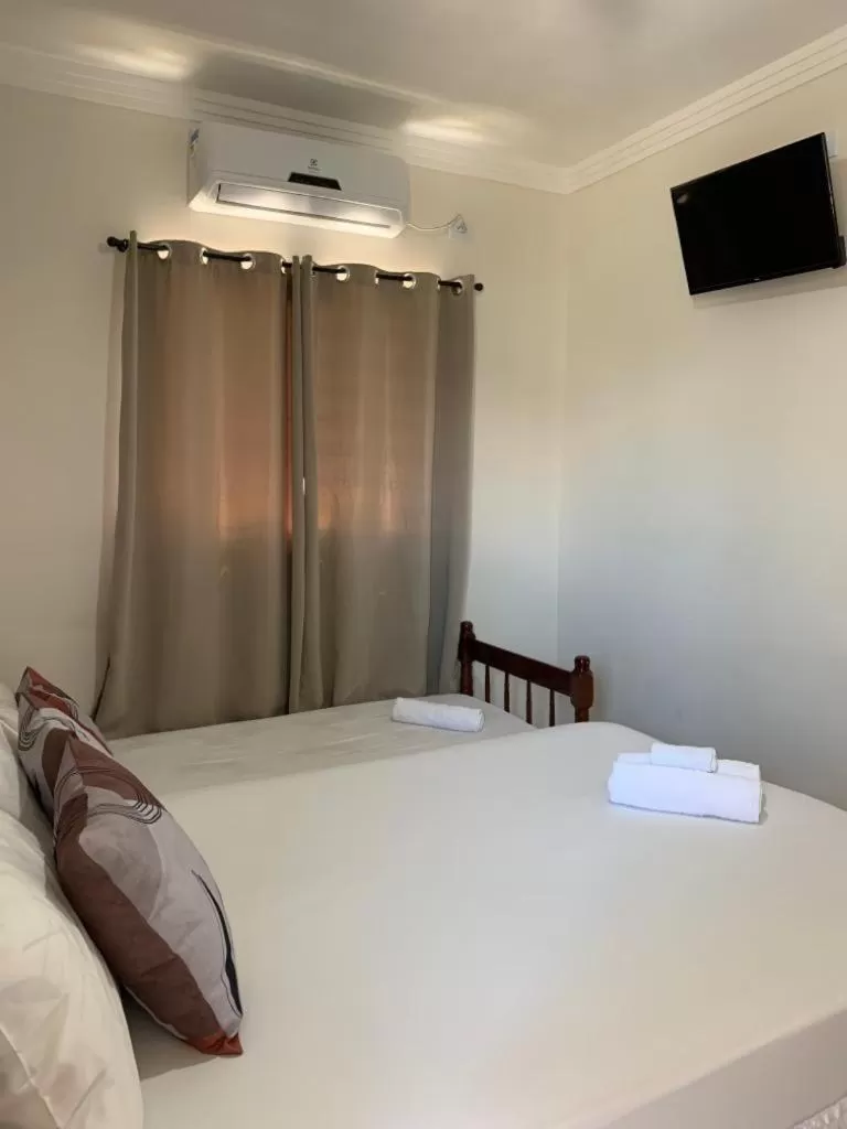 Bed in Pousada Recanto Som do Mar