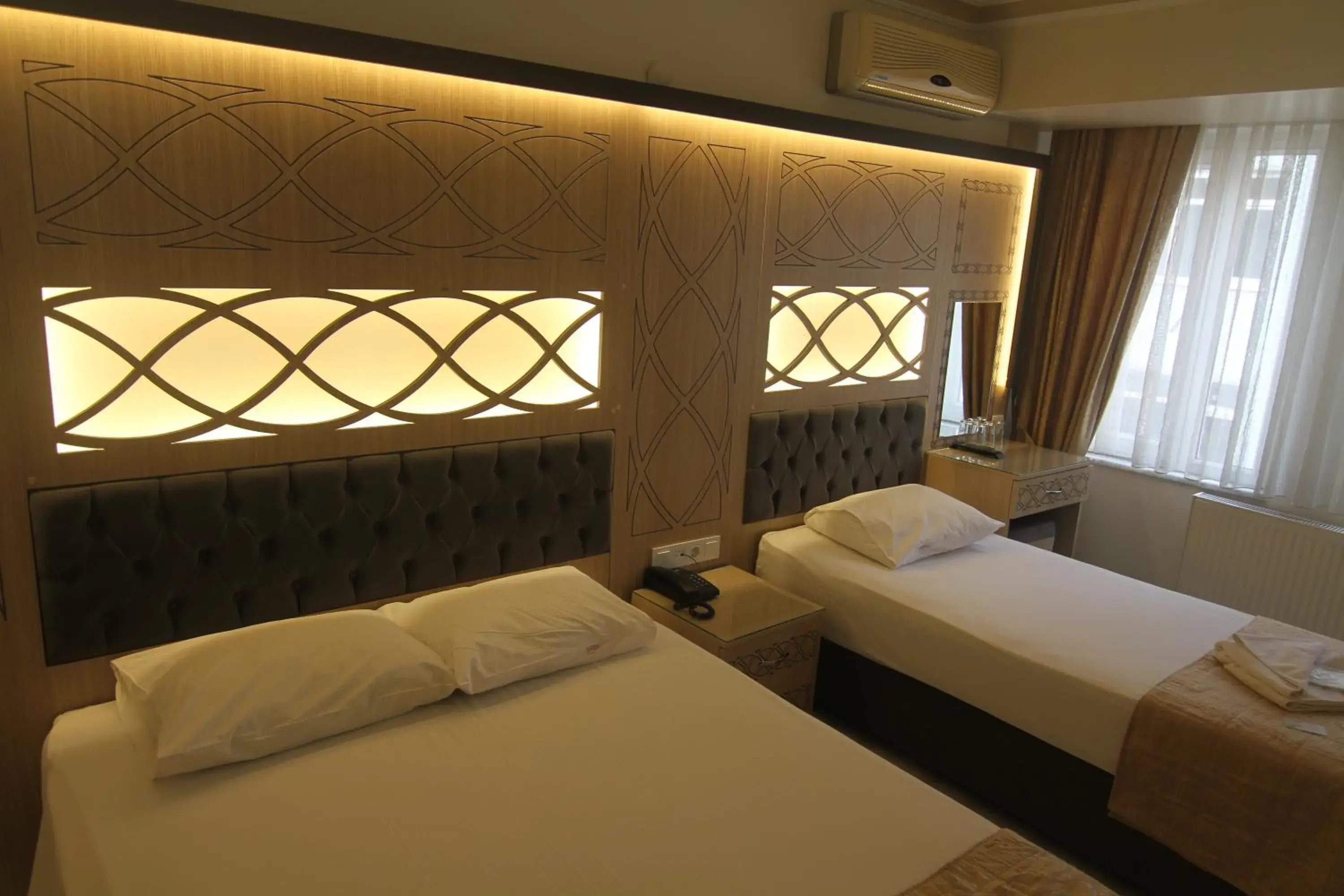 Bedroom, Bed in Grand Liza Hotel