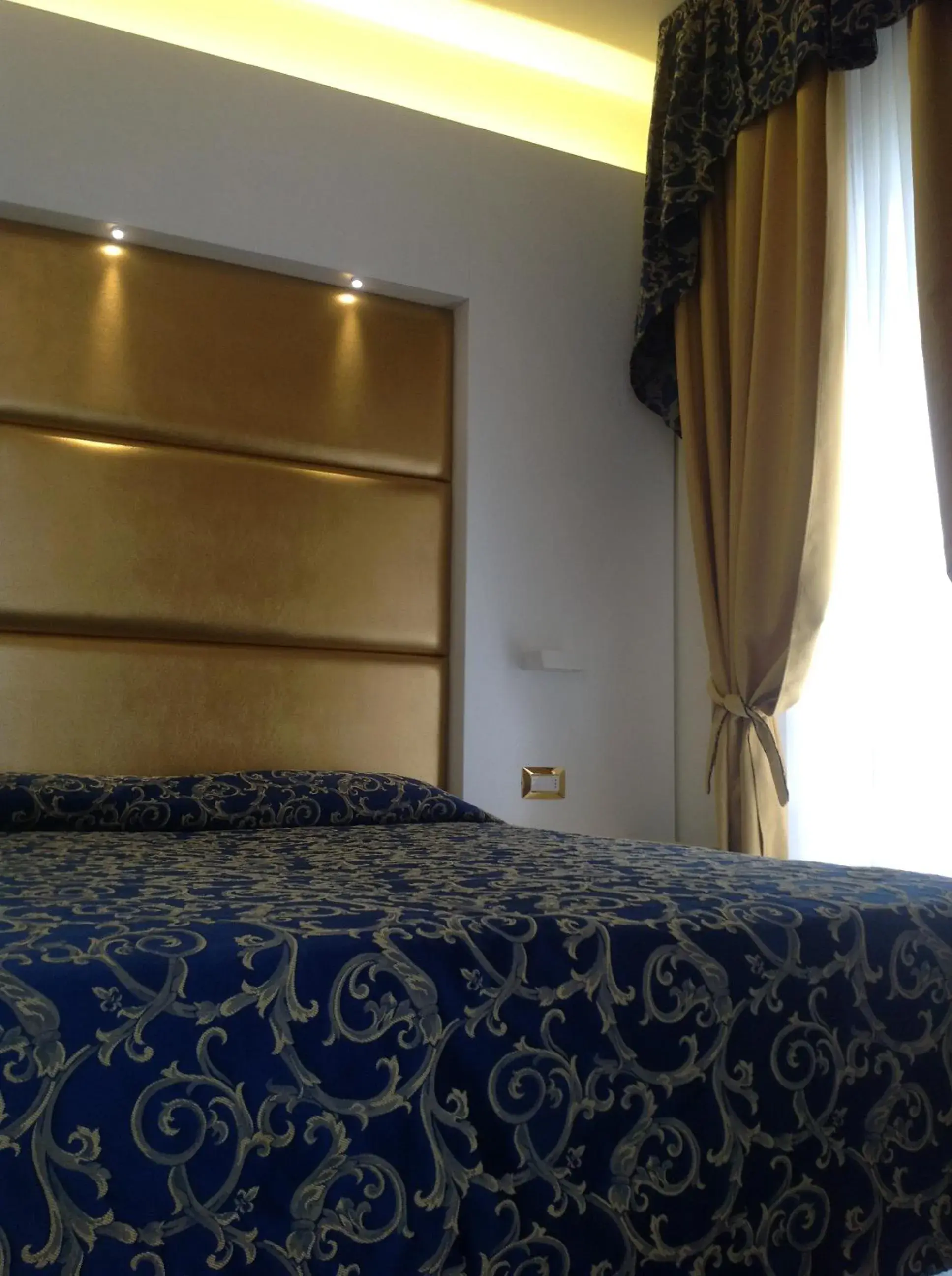 Bed in Hotel Ambassador