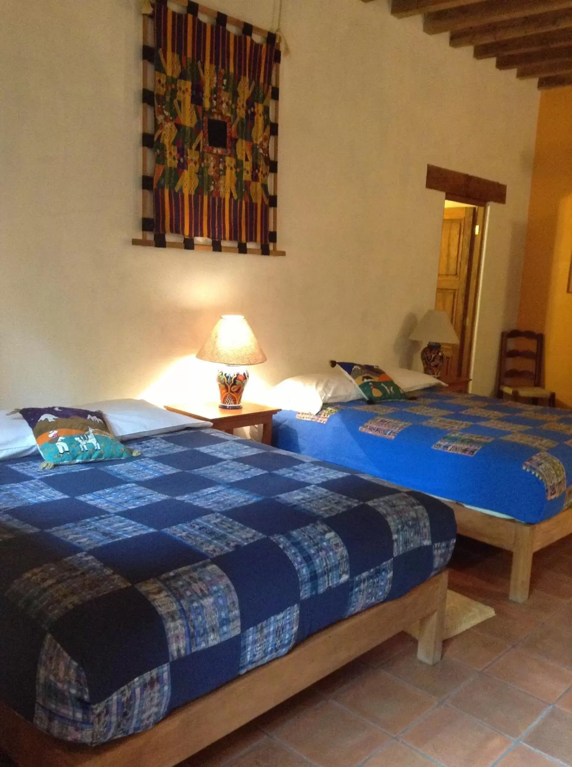 Photo of the whole room, Bed in Posada Yolihuani