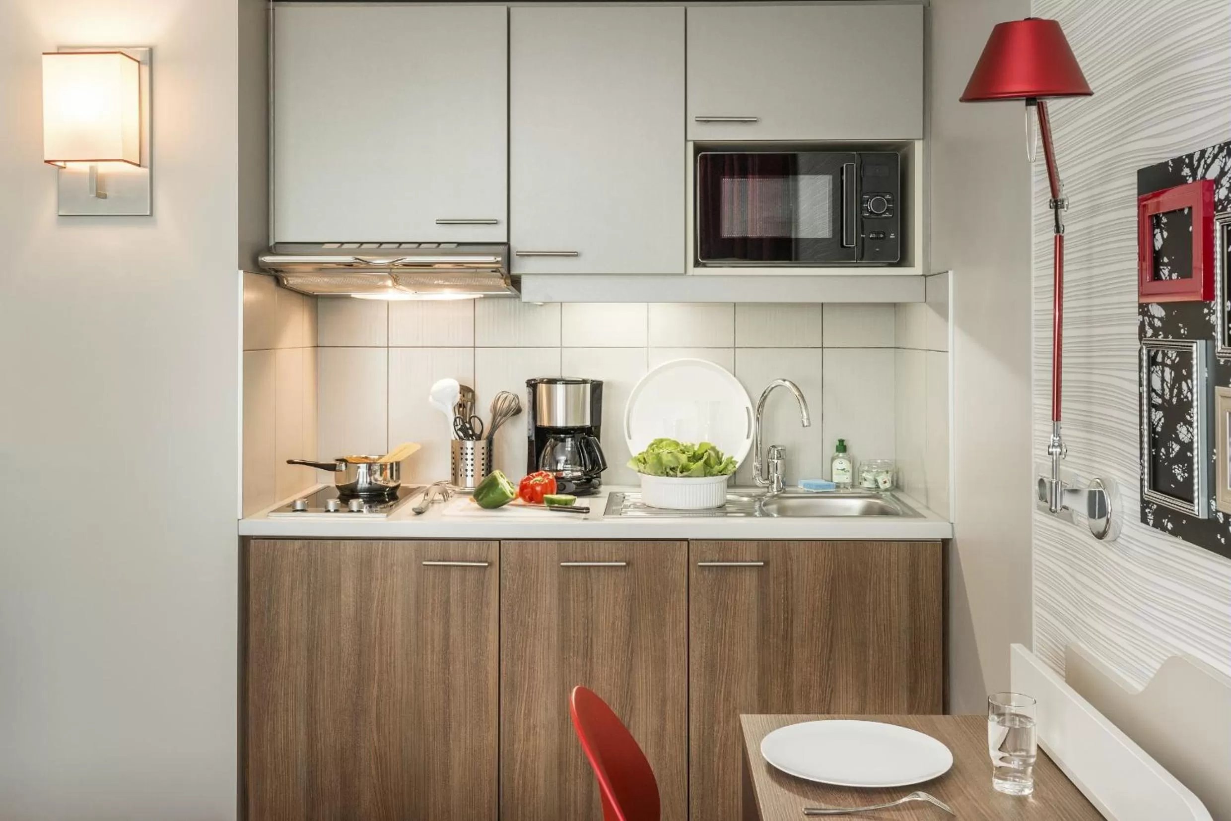 Kitchen or kitchenette in Aparthotel Adagio Paris Bercy Village