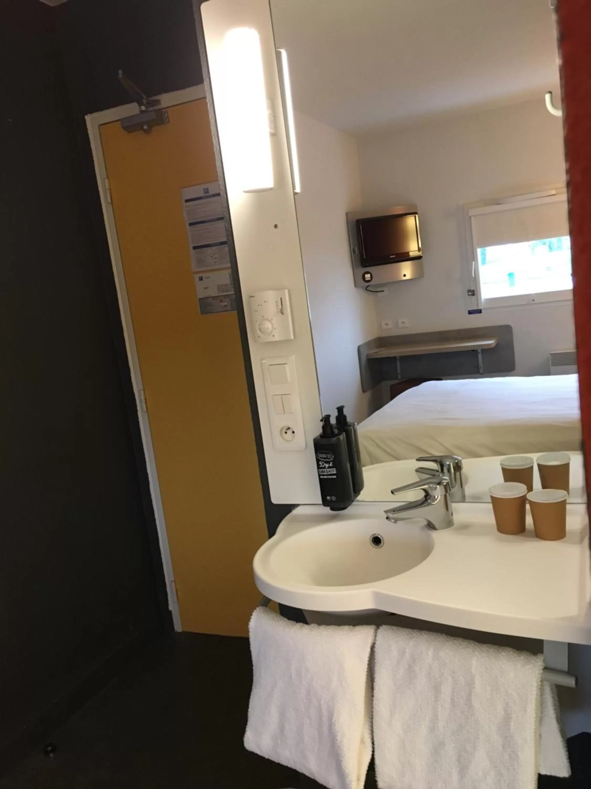 Bathroom, Bed in ibis budget Rochefort