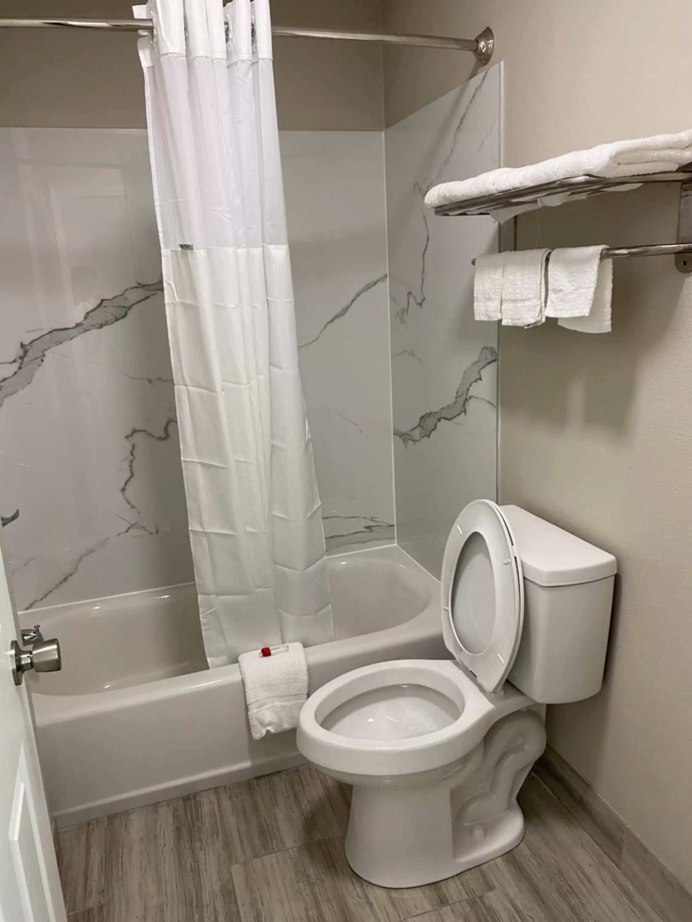 Toilet, Bathroom in Days Inn by Wyndham Lake Charles