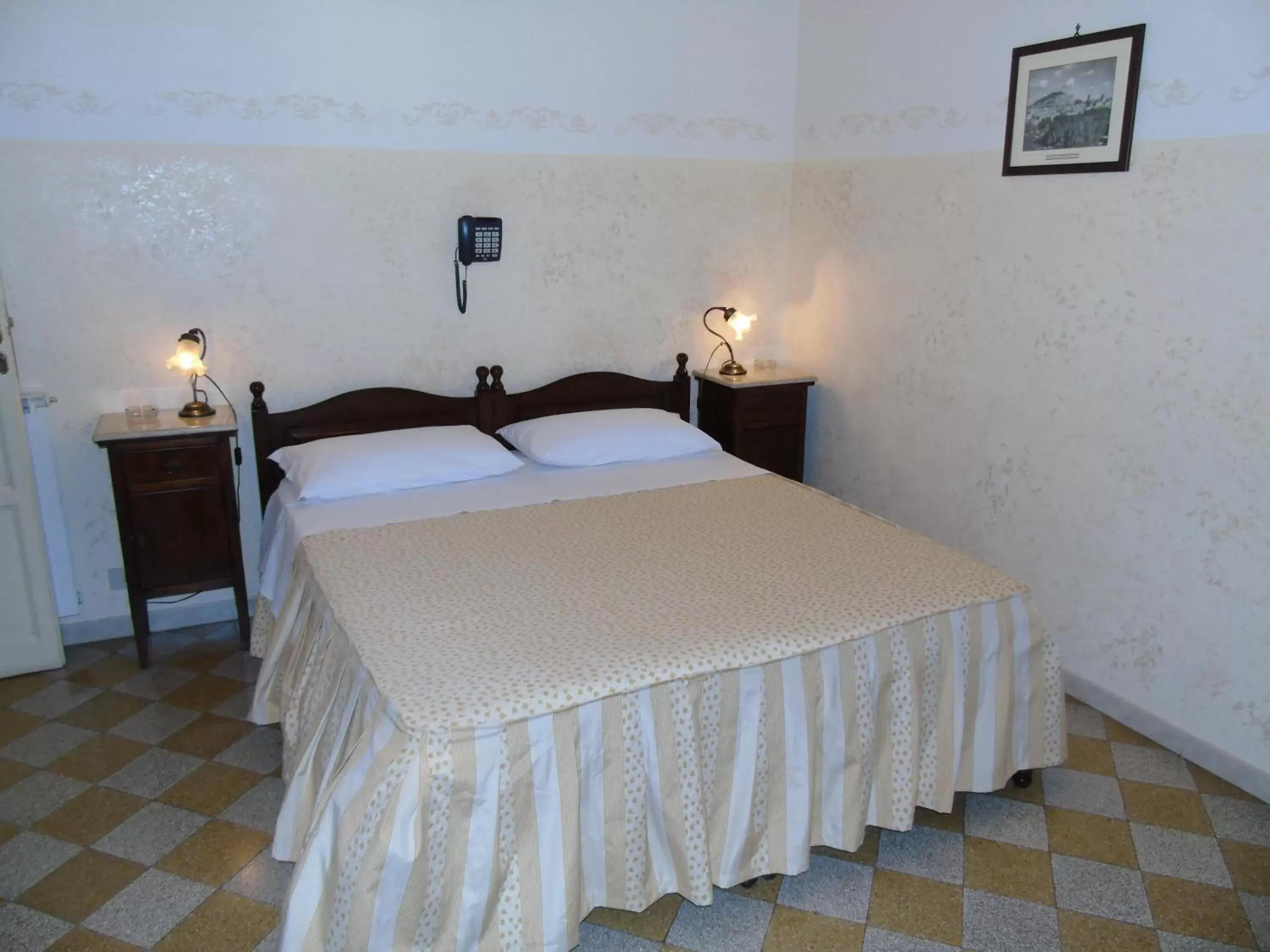 Bed in Albergo Cavour