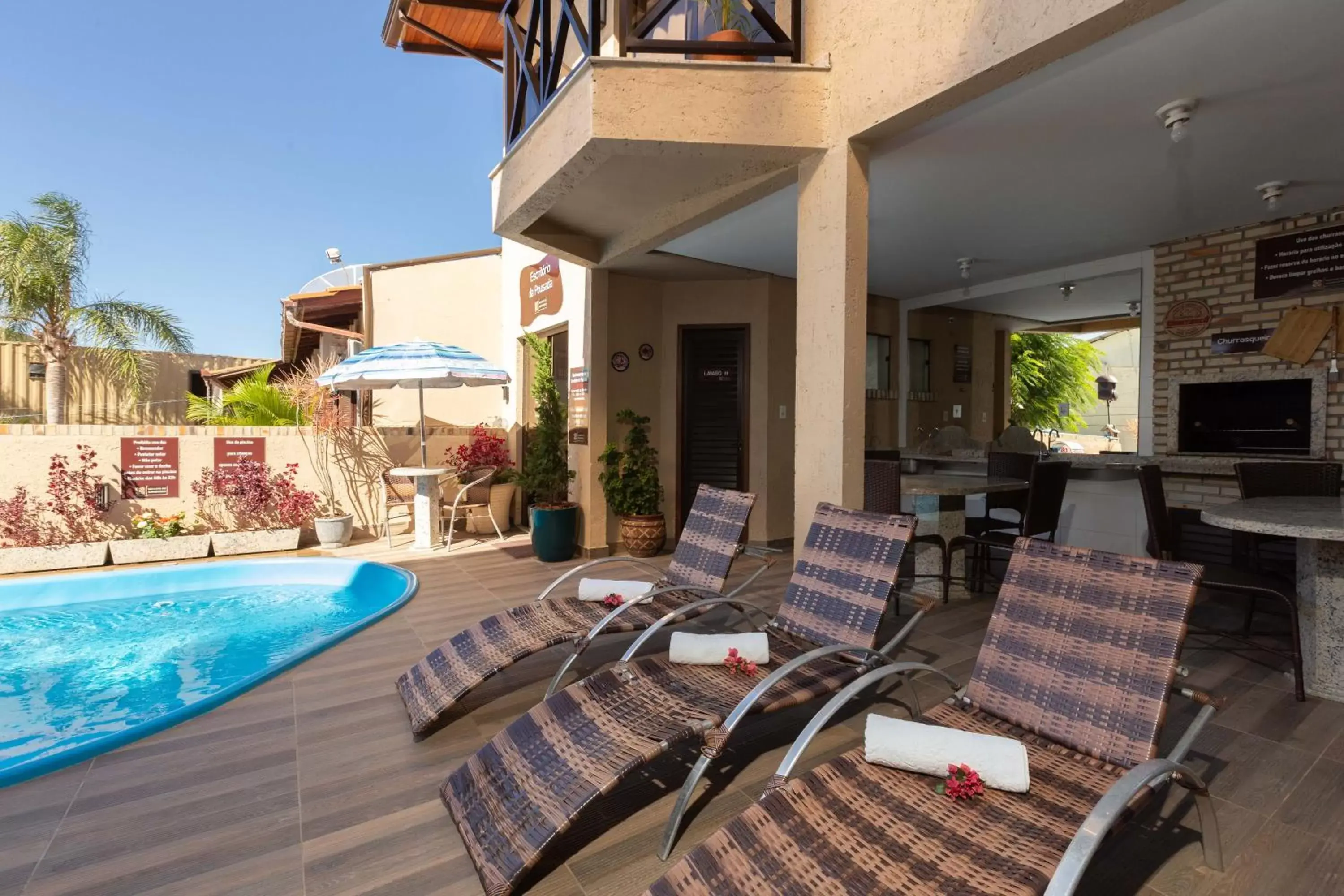 Seating area, Swimming Pool in Pousada Recanto do Aconchego