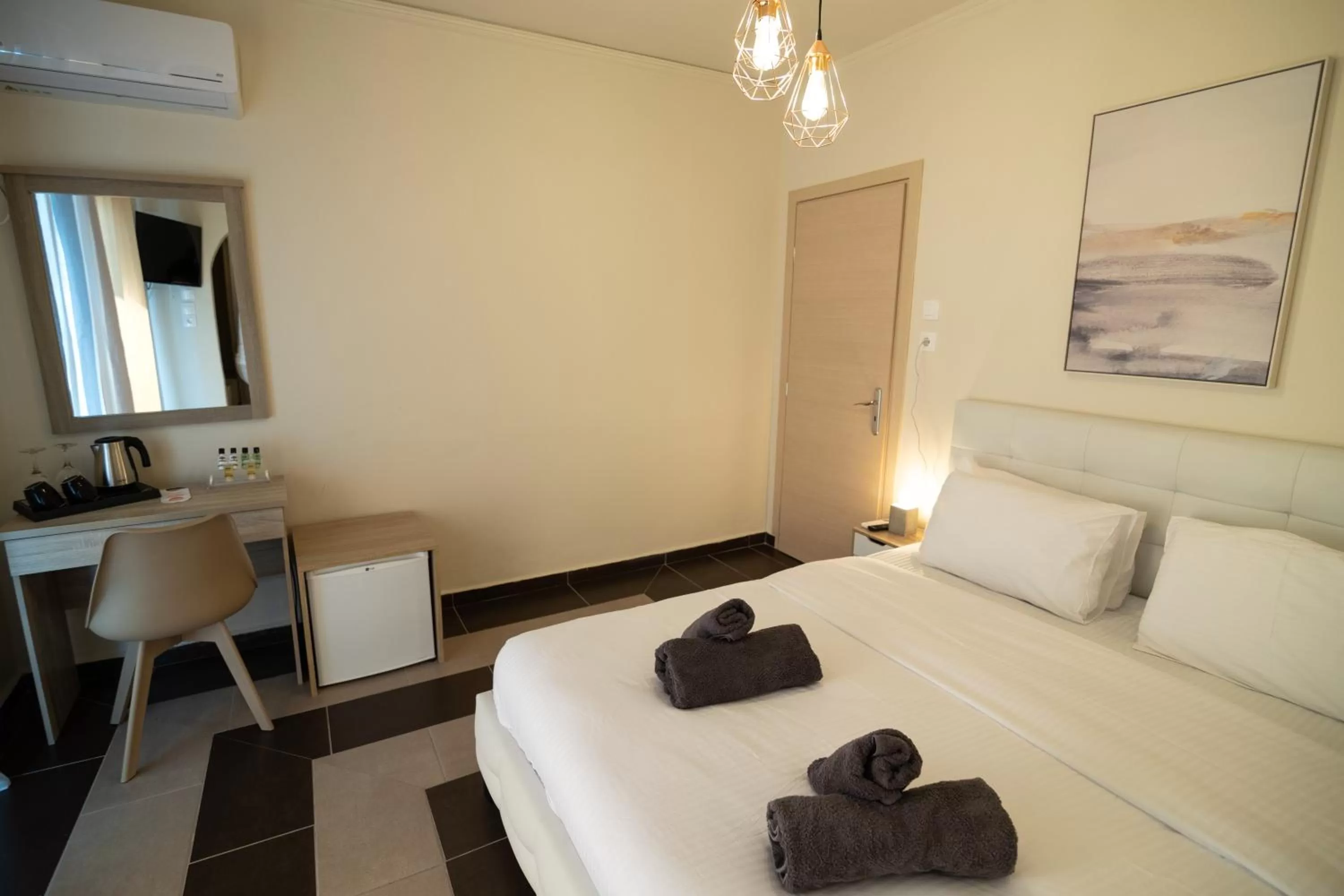 Bed in Votsalakia Hotel & Luxury Apartments