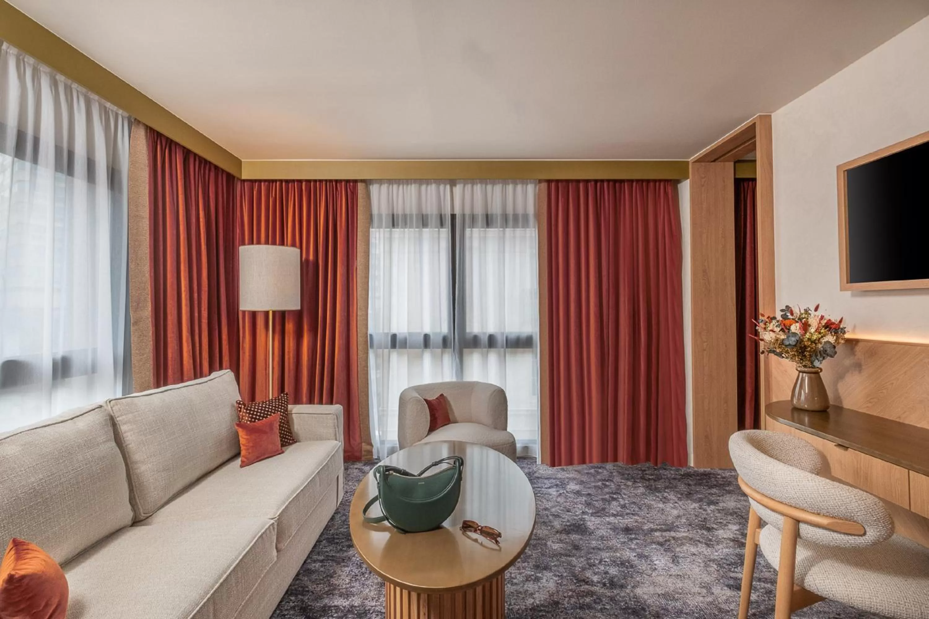 Communal lounge/ TV room in Hôtel Burdigala by Inwood Hotels