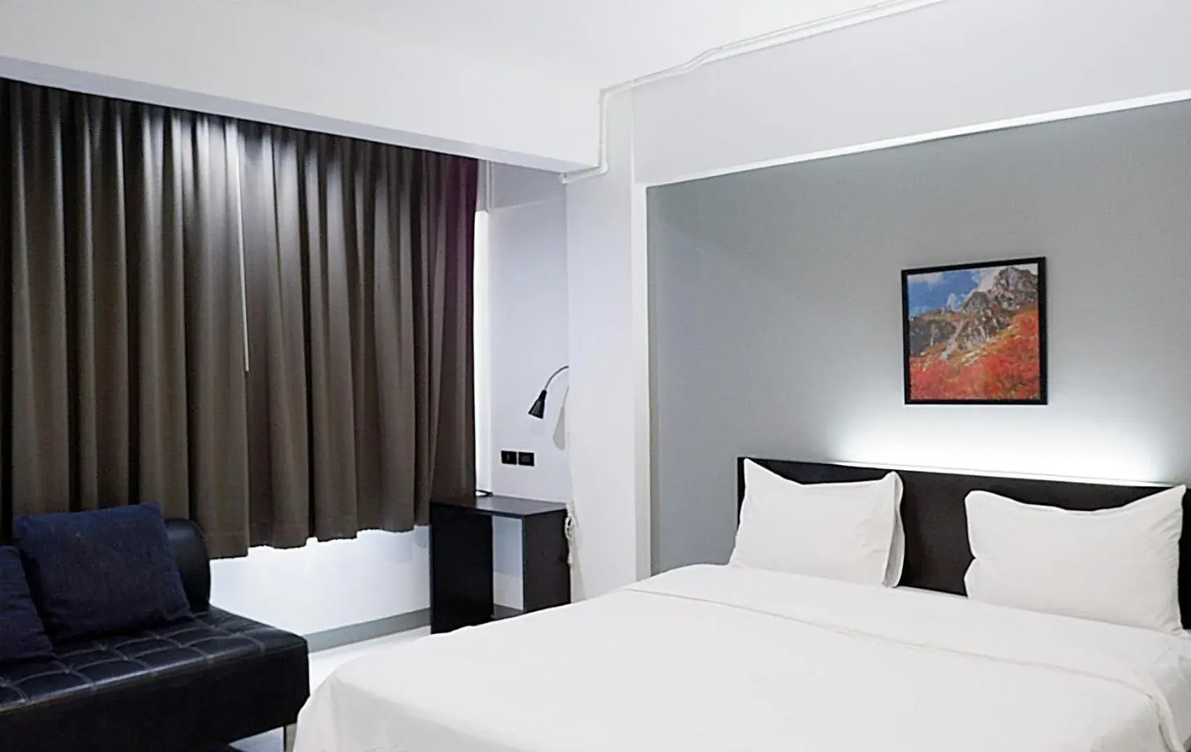 Bed in Izen Budget Hotel & Residence