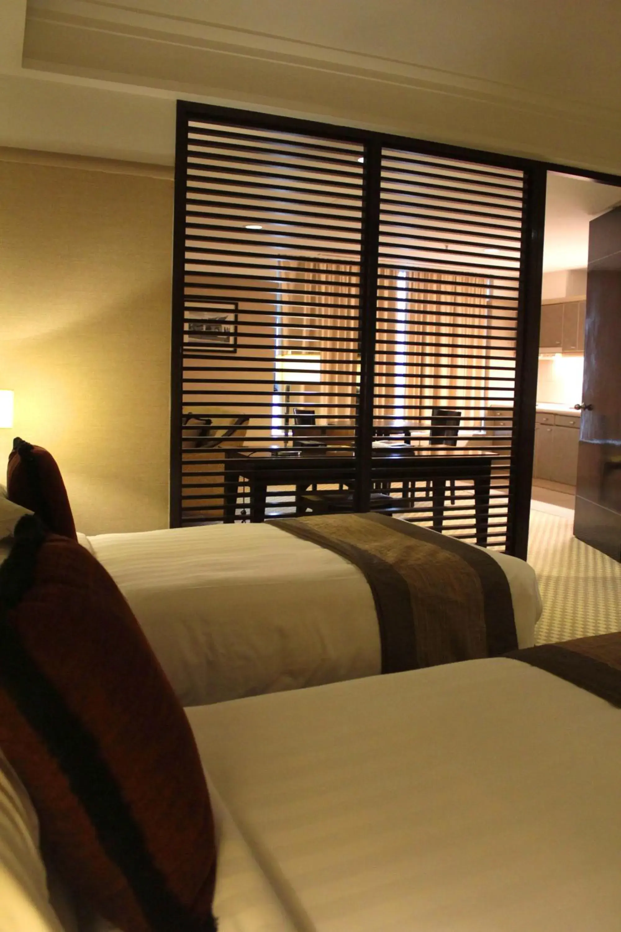 Bed in Pacific Regency Hotel Suites