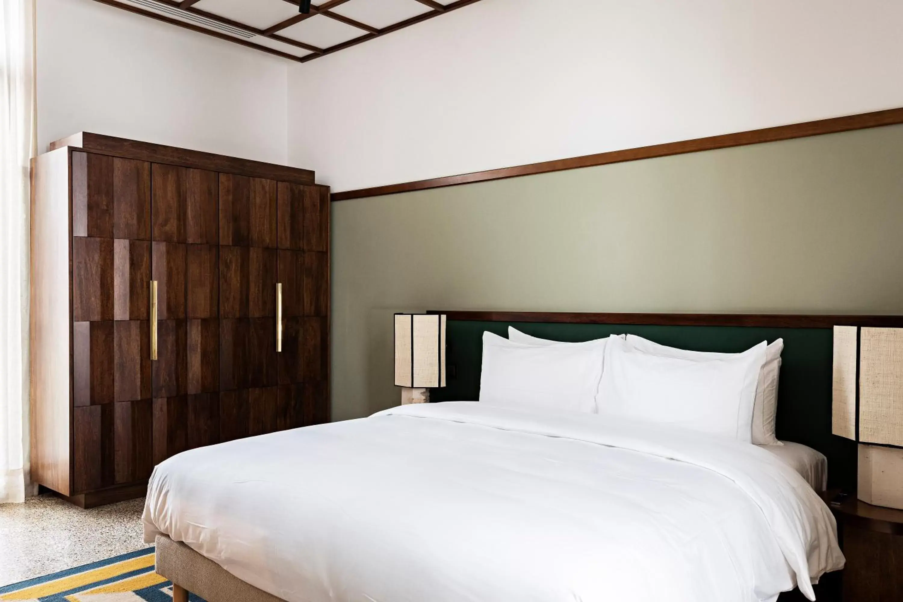 Bed in La Maison Palmier Abidjan, a Member of Design Hotels Bed in La Maison Palmier Abidjan, a Member of Design Hotels