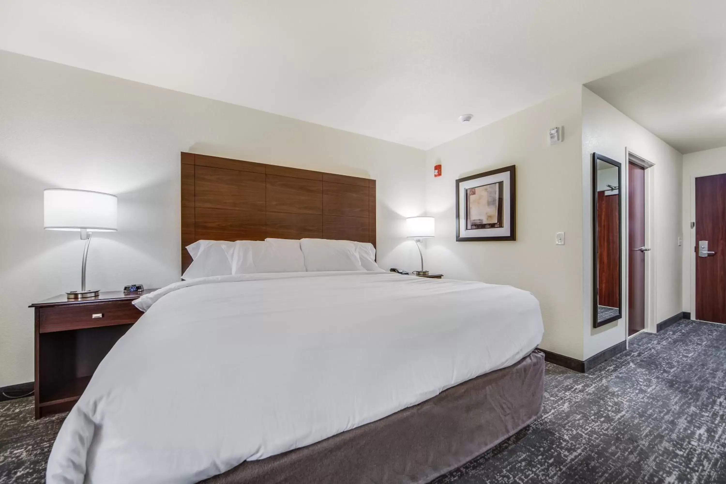 Bed in Cobblestone Hotel & Suites - Cozad